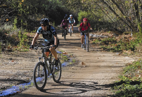 Bicyclists take off on a morning ride through Whiting Ranch Wilderness Park on Feb. 14, 2014. (Mark Boster / Los Angeles Times)