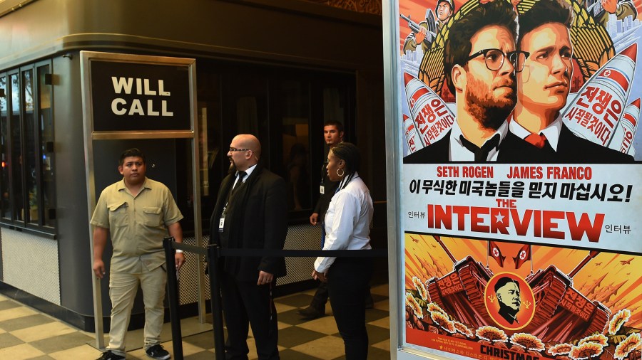 Security is seen outside The Theatre at Ace Hotel before the premiere of the film 'The Interview' in Los Angeles on Dec. 11, 2014. (Credit: AFP/Getty Images)