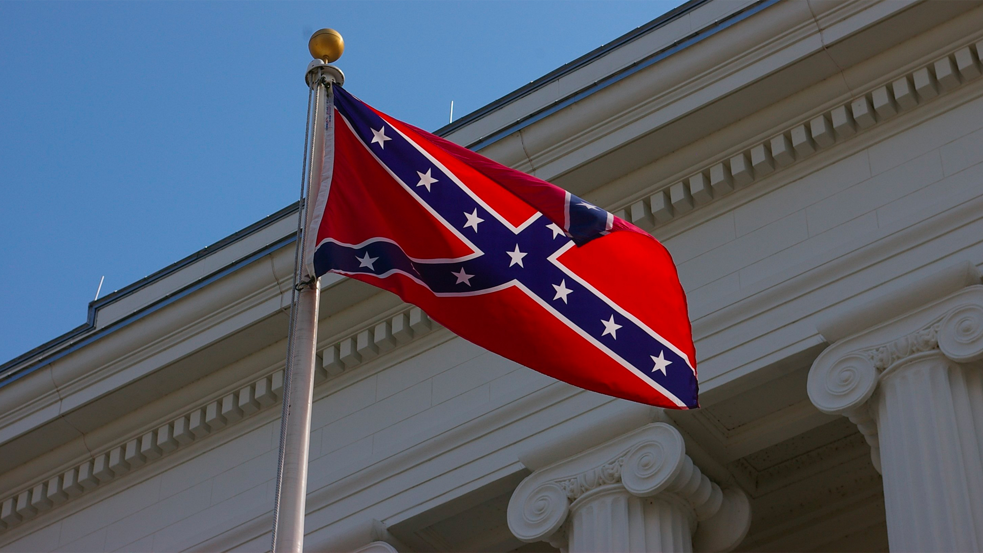 The Confederate battle flag flies at a Confederate war memorial on the grounds of Alabama state capitol in Montgomery on February 26, 2009. (Credit: Wes Little/CNN)