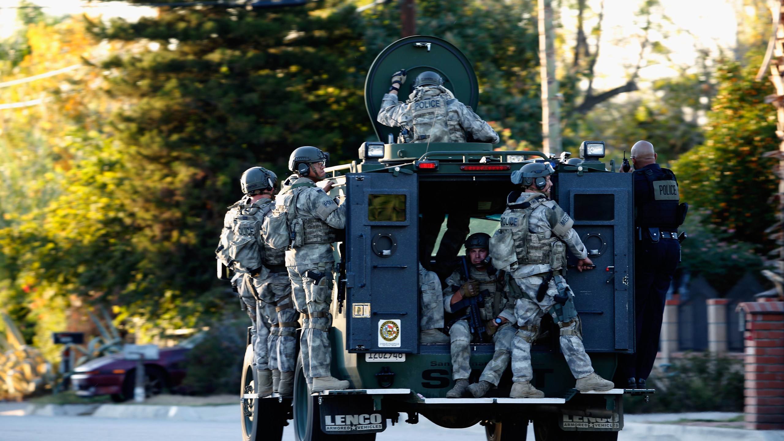 SWAT officers enter an area where suspects were believed to be after the shooting at the Inland Regional Center on Dec. 2, 2015, in San Bernardino, California. (Credit: Sean M. Haffey/Getty Images)