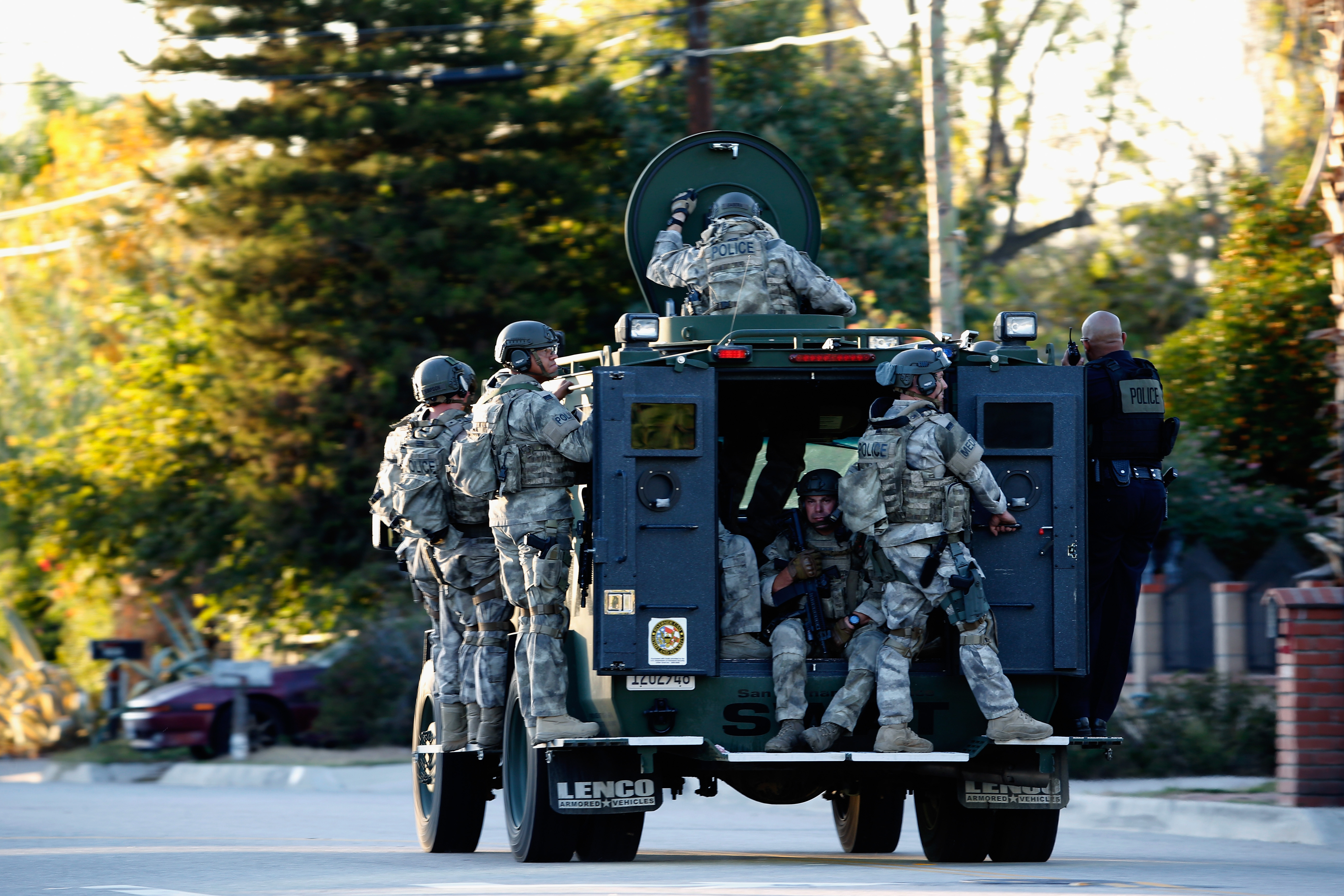 SWAT officers enter an area where suspects were believed to be after the shooting at the Inland Regional Center on Dec. 2, 2015, in San Bernardino, California. (Credit: Sean M. Haffey/Getty Images)