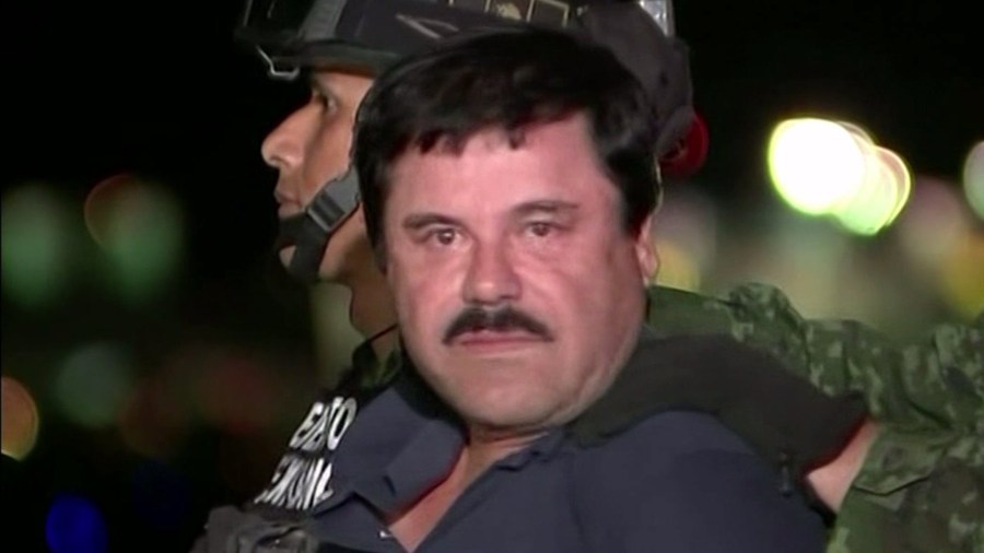 Mexican forces escorted Joaquin "El Chapo" Guzman out of an armored vehicle and into a helicopter on Jan. 8, 2016, following his arrest after months on the run. (Credit: CEPROPIE via CNN)