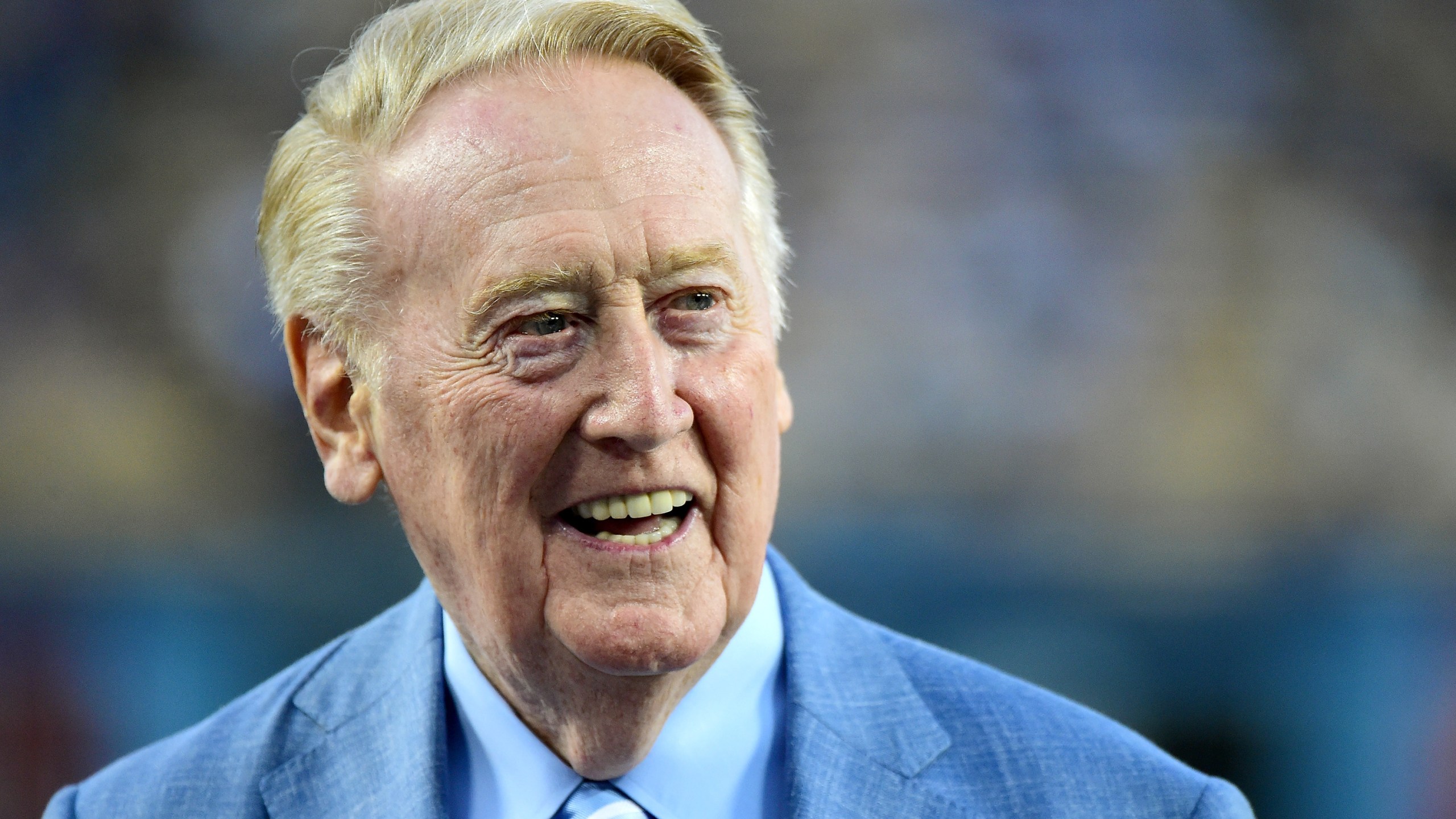 Los Angeles Dodgers broadcaster Vin Scully smiles on the field before the game against the Arizona Diamondbacks at Dodger Stadium on Sept. 23, 2015. (Harry How/Getty Images)