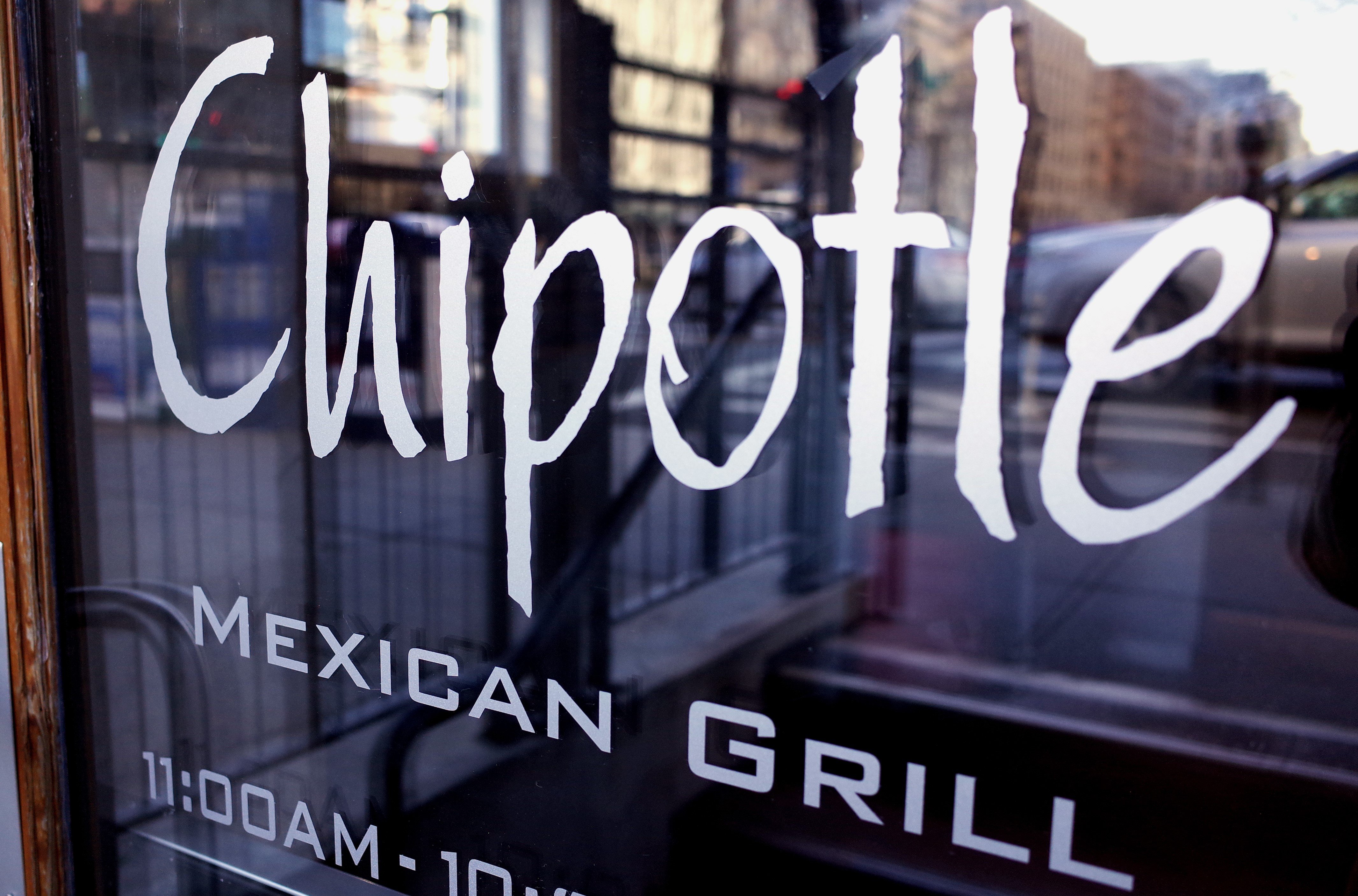 The Chipotle logo is seen on the door of one of its restaurants on Jan. 11, 2015, in Washington, D.C. (Credit: MANDEL NGAN/AFP/Getty Images)