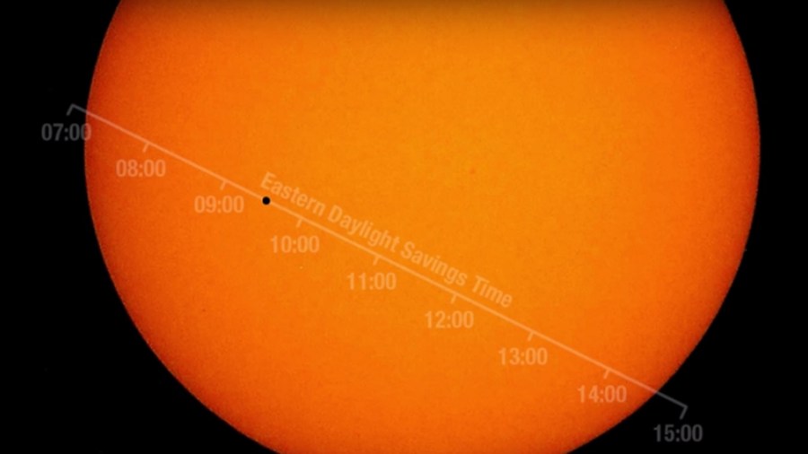 In this handout image provided by NASA, the planet Mercury is seen in silhouette, low center, as it transits across the face of the Sun on Nov. 11, 2019. (Credit: Bill Ingalls/NASA)