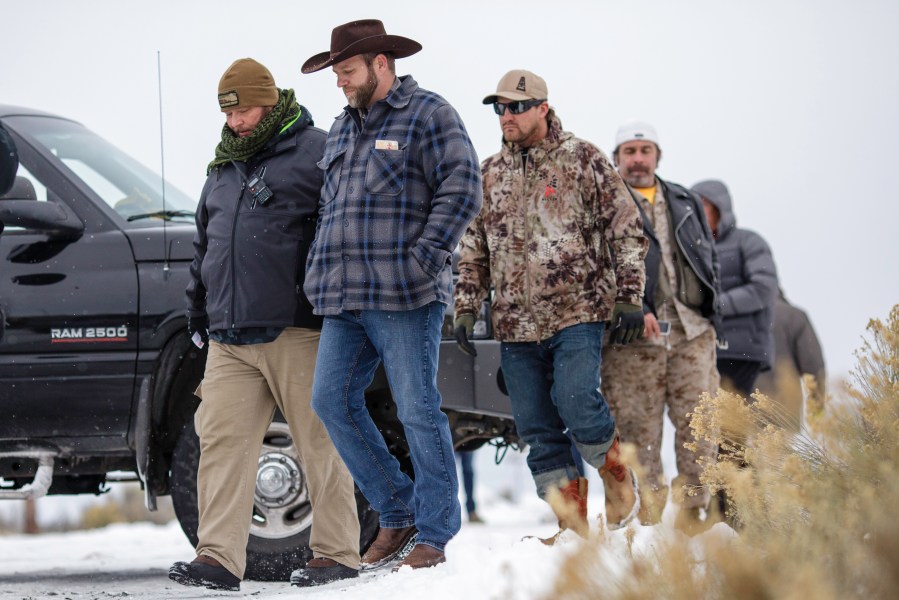 Ammon Bundy, in front, leader of an armed anti-government militia, returns to the Malheur National Wildlife Refuge Headquarters near Burns, Oregon Jan. 5, 2016, following a news conference. (Rob Kerr/AFP/Getty Images)