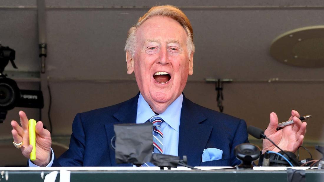 Dodgers broadcast announcer Vin Scully waves to the crowd during his last broadcast. (Wally Skalij / Los Angeles Times)