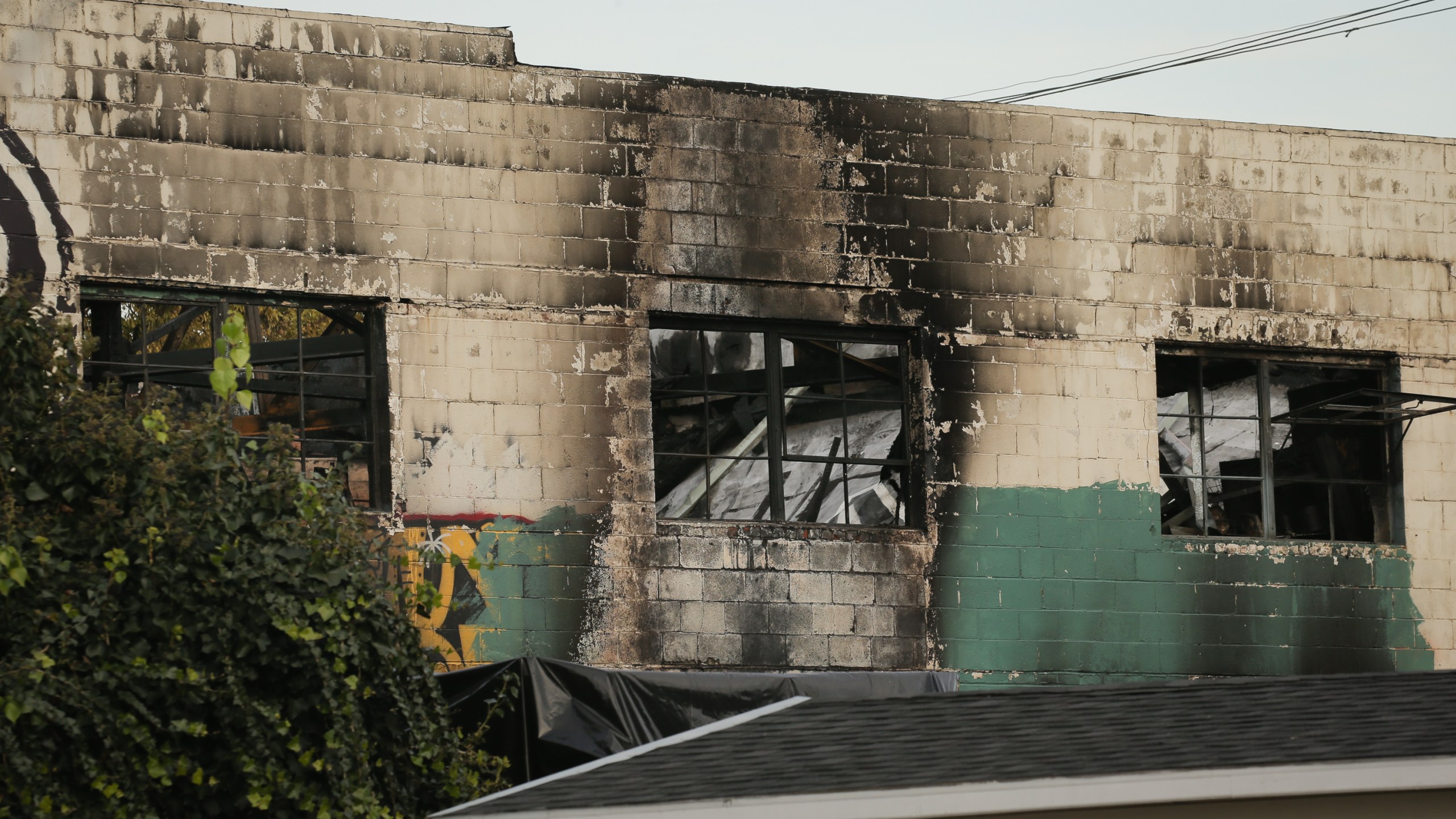 The burnt exterior of a warehouse in which a fire claimed the lives of at least thirty-three people is seen on December 4, 2016 in Oakland, California. (Elijah Nouvelage/Getty Images)