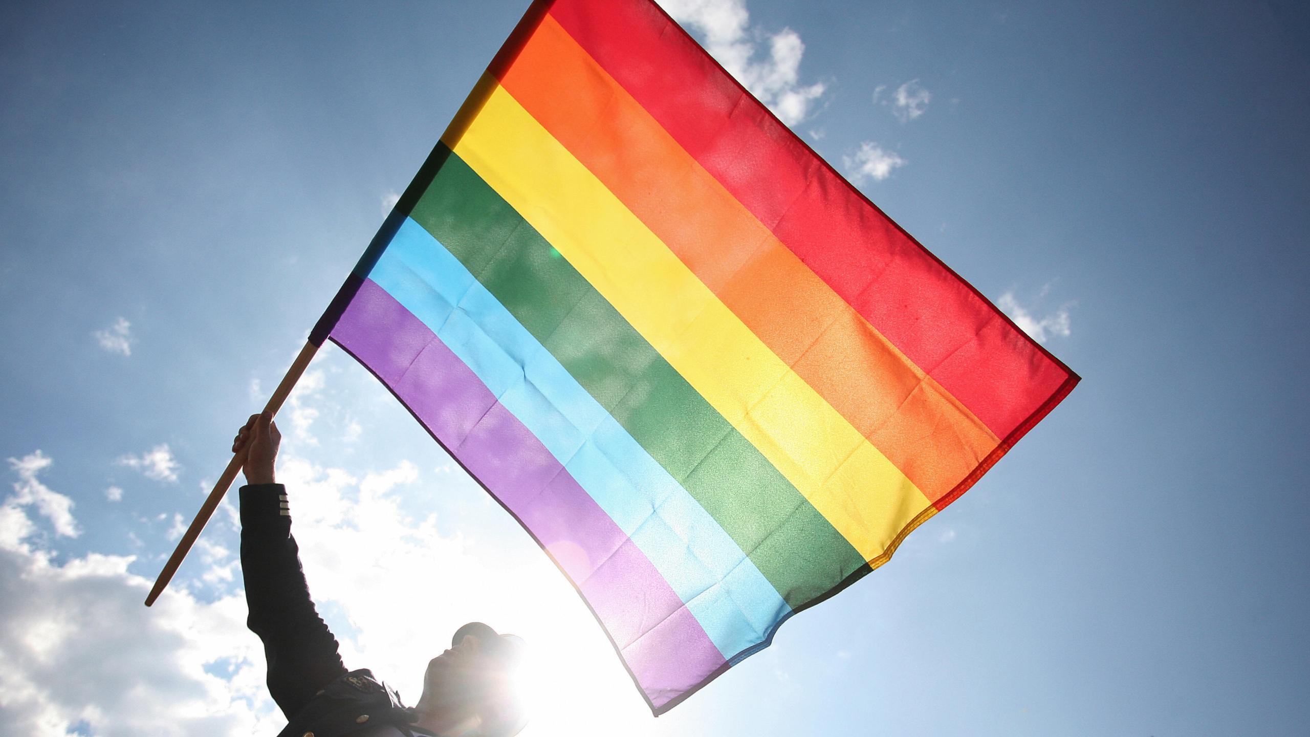 A person wave a rainbow flag as he takes part to the Gay Pride parade on June 7, 2008 in Warsaw. (Wojtek Radwanski/AFP/Getty Images)