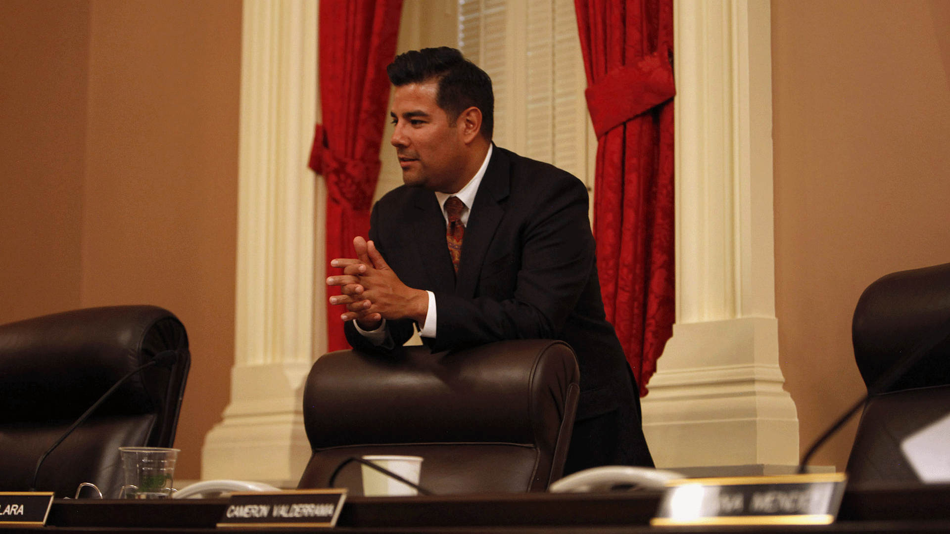 Sen. Ricardo Lara (D-Bell Gardens) rests on his chair during a break in a Senate Rules Committee meeting in Sacramento. (Credit: Katie Falkenberg / Los Angeles Times)