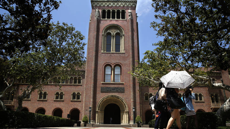 In a file photo, students walk on the campus of the University of Southern California. (Don Bartletti / Los Angeles Times)