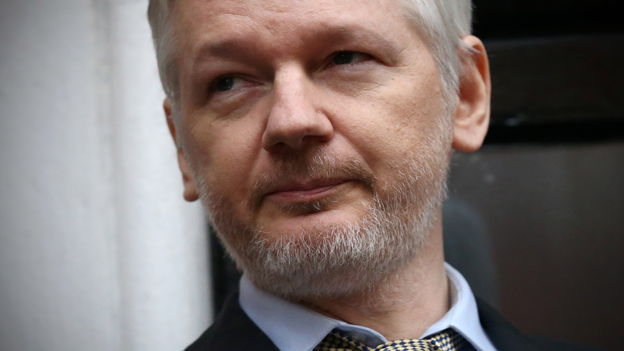 Wikileaks founder Julian Assange speaks from the balcony of the Ecuadorian embassy where he continues to seek asylum following an extradition request from Sweden in 2012, on Feb. 5, 2016, in London, England.(Credit: Carl Court / Getty Images)