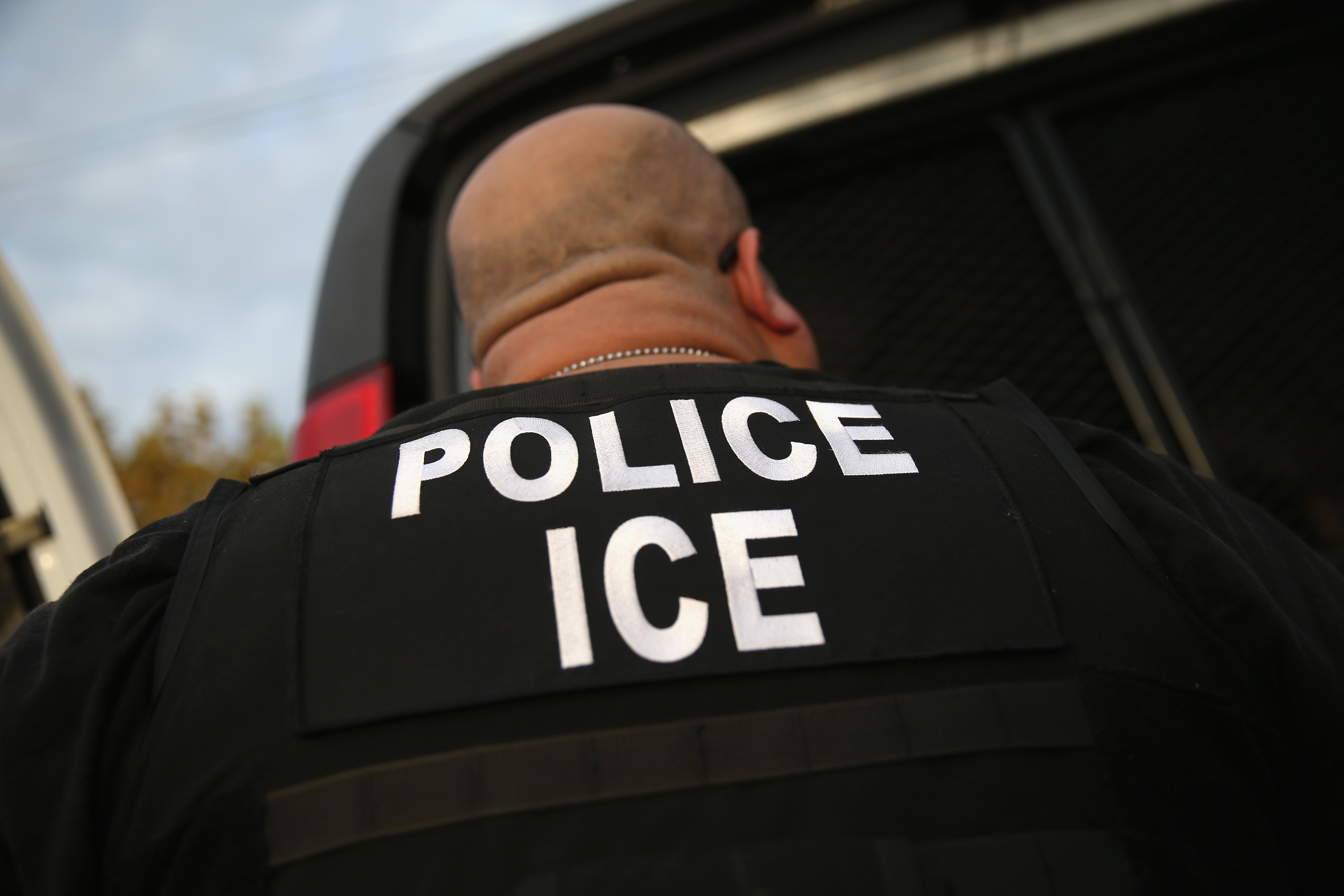 U.S. Immigration and Customs Enforcement (ICE) agents detain an immigrant on Oct. 14, 2015, in Los Angeles. (Credit: John Moore/Getty Images)