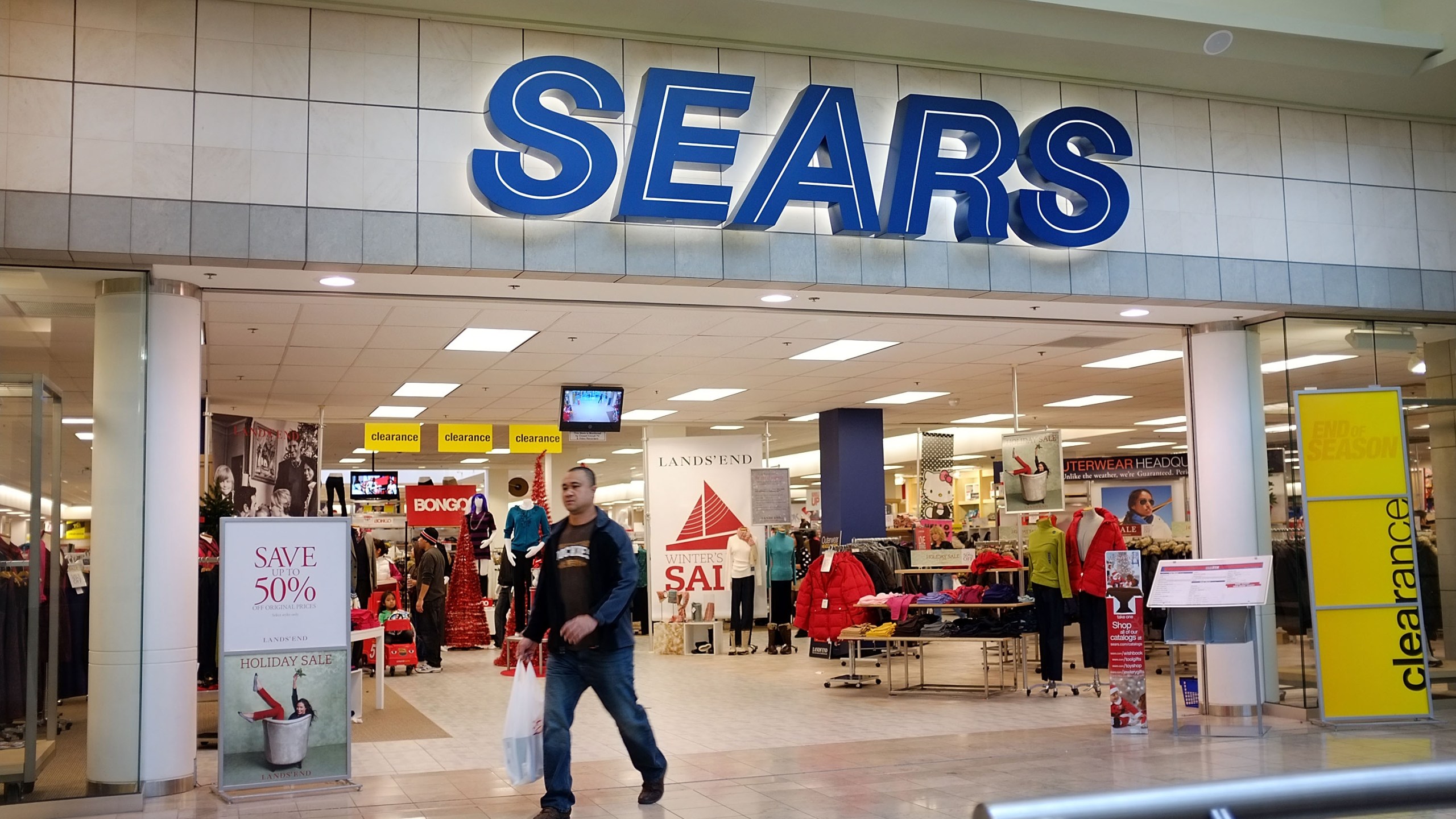 A man walks out of a Sears store on Dec. 27, 2011 in Milford, Connecticut. (Credit: Spencer Platt/Getty Images)