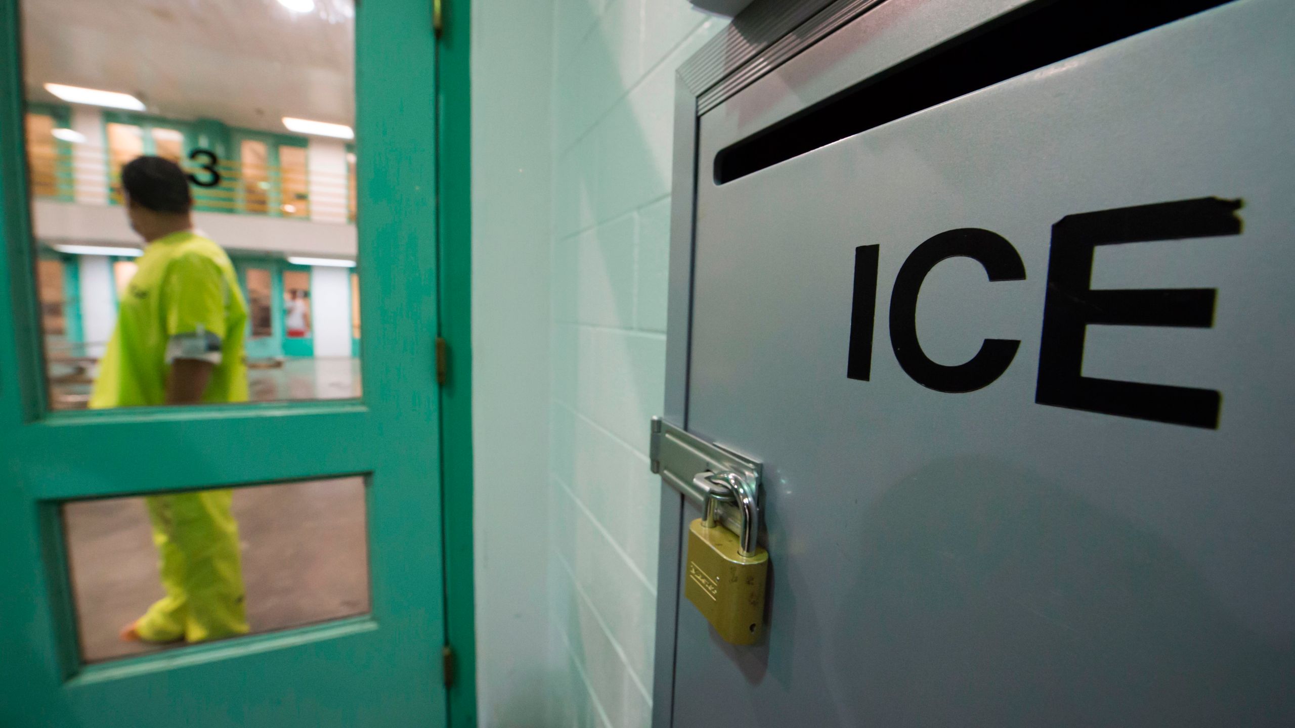 An immigration detainee stands near a U.S. Immigration and Customs Enforcement grievance box in the high-security unit at the Theo Lacy Facility, a county jail in Orange that also houses immigration detainees arrested by ICE, on March 14, 2017. (Credit: Robyn Beck / AFP / Getty Images)