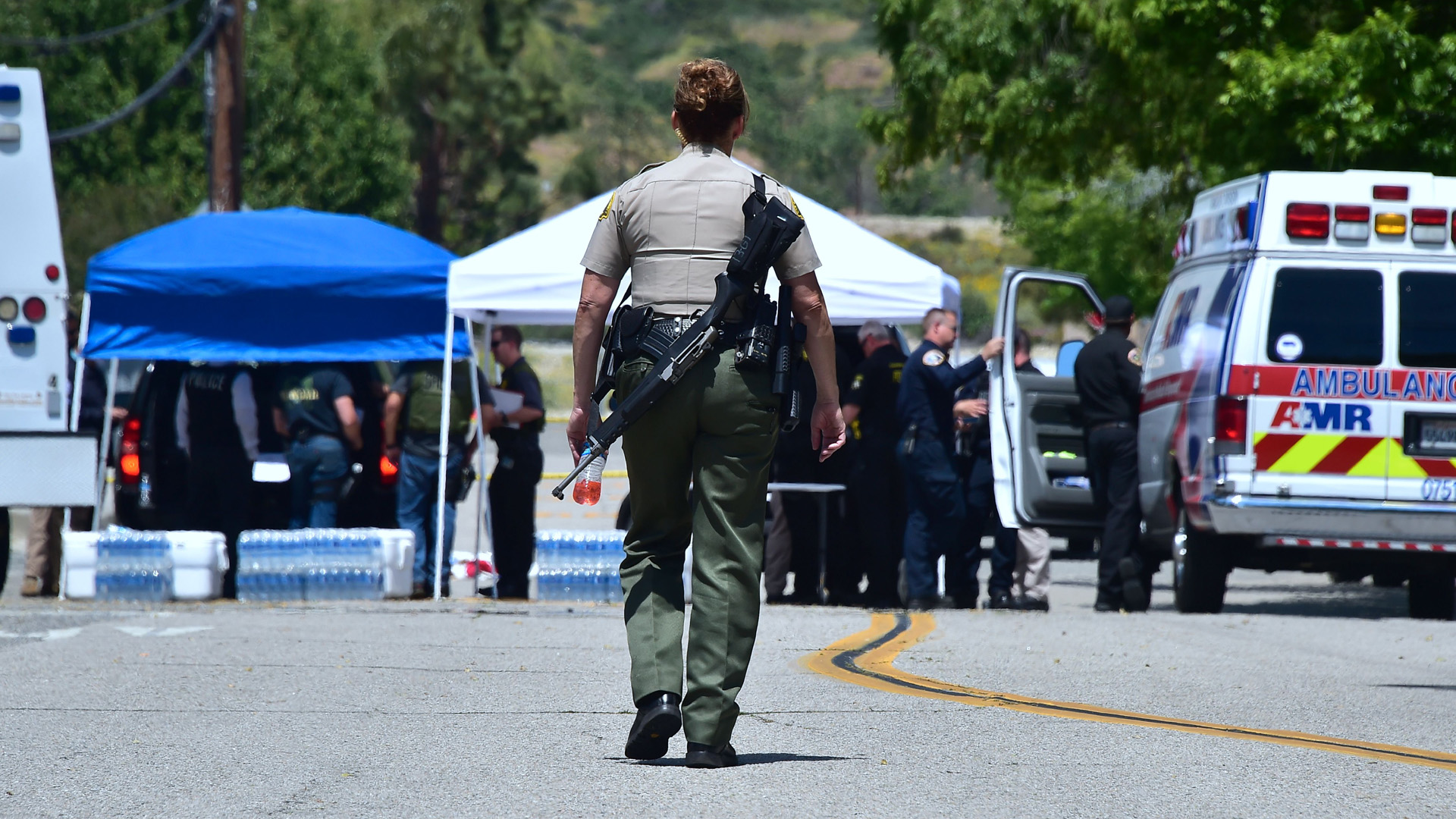 Law enforcement personnel are seen outside a closed-off North Park Elementary School in San Bernardino on April 10, 2017, following a shooting at the school. (Credit: Frederic J. Brown/AFP/Getty Images)