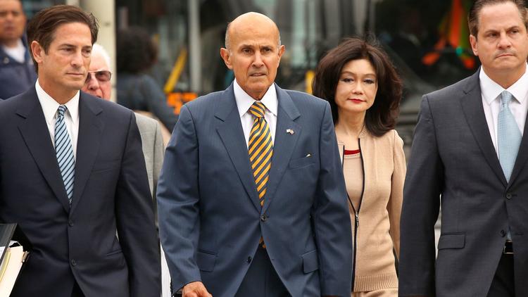 Former Los Angeles County Sheriff Lee Baca walks with his wife and attorneys to the U.S. District Courthouse in Los Angeles for his sentencing on May 12, 2017. (Credit: Al Seib / Los Angeles Times)