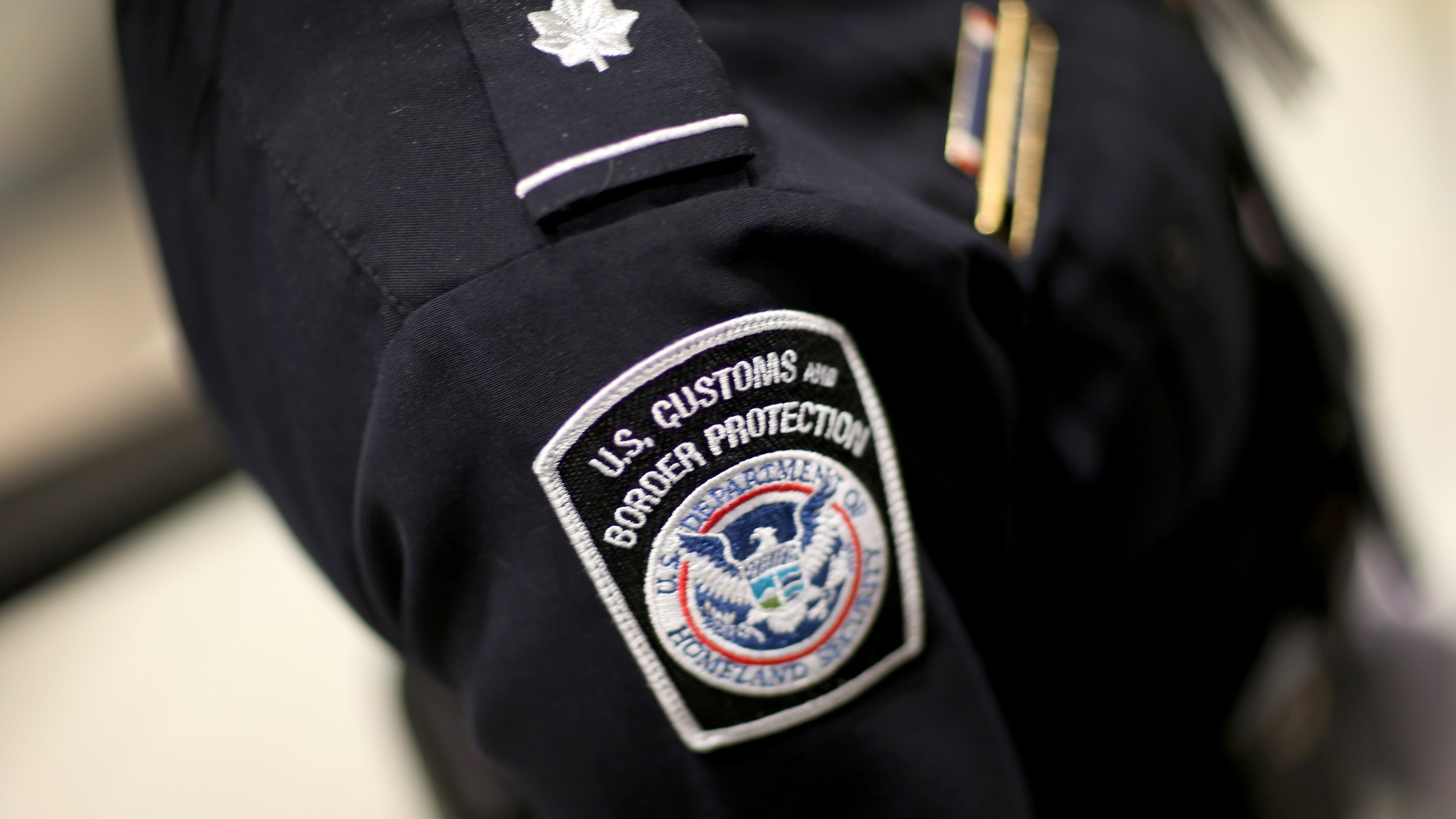 A U.S. Customs and Border Protection officer's patch is seen as they unveil a new mobile app for international travelers arriving at Miami International Airport on March 4, 2015. (Credit: Joe Raedle / Getty Images)