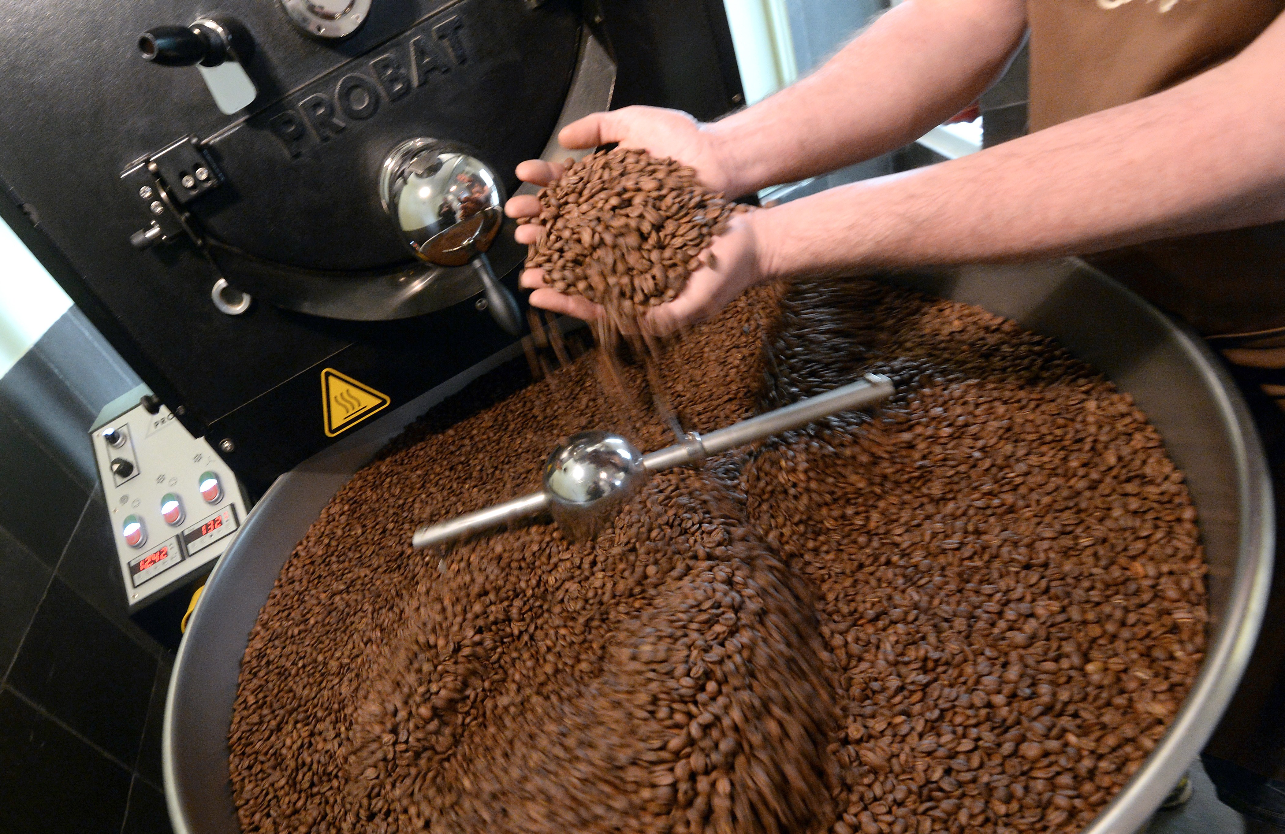 Coffee beans are seen being ground in this undated photo. (Credit: PIERRE ANDRIEU/AFP/Getty Images)