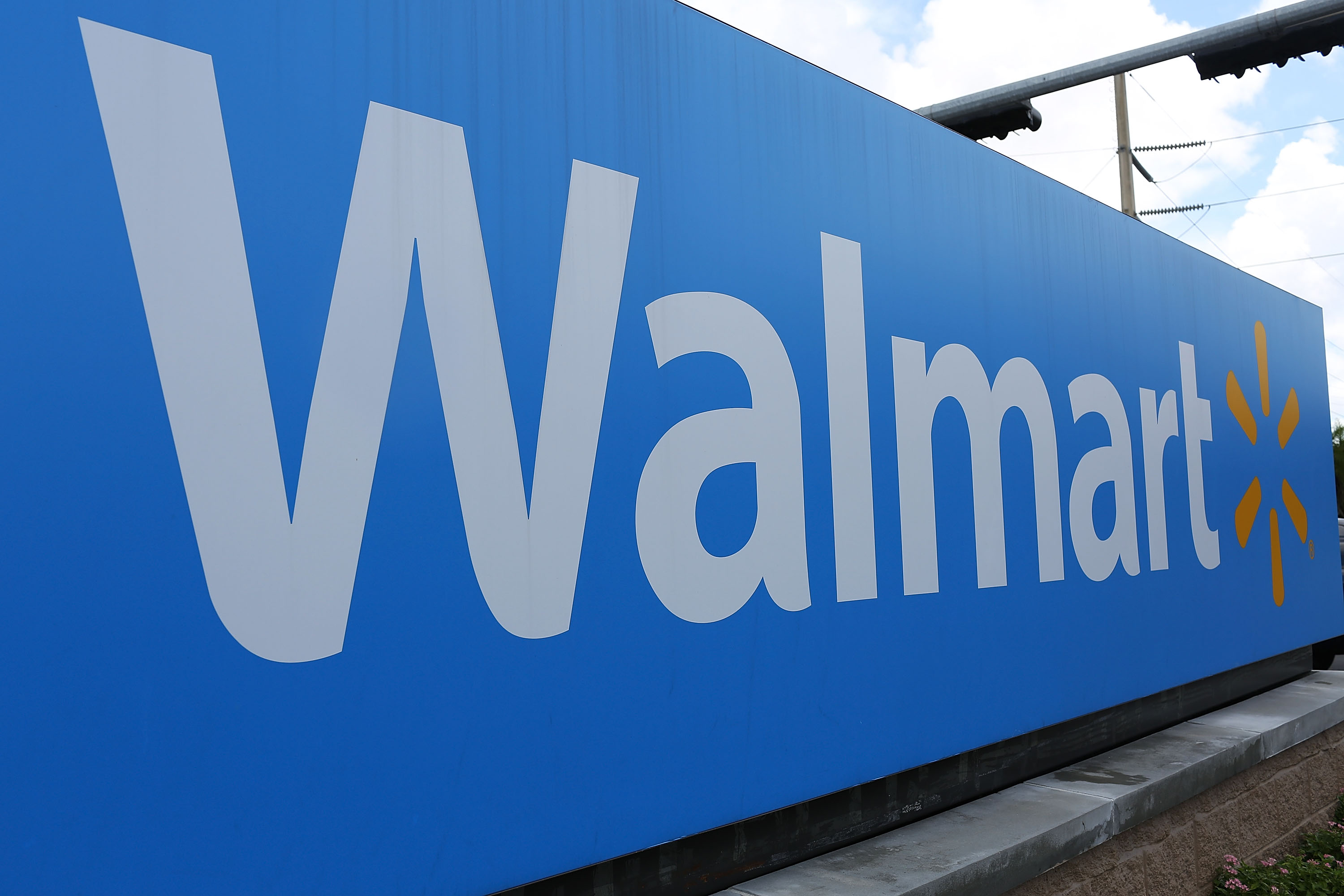 A Walmart sign is seen on August 18, 2015 in Miami, Florida. (Credit: Joe Raedle/Getty Images)