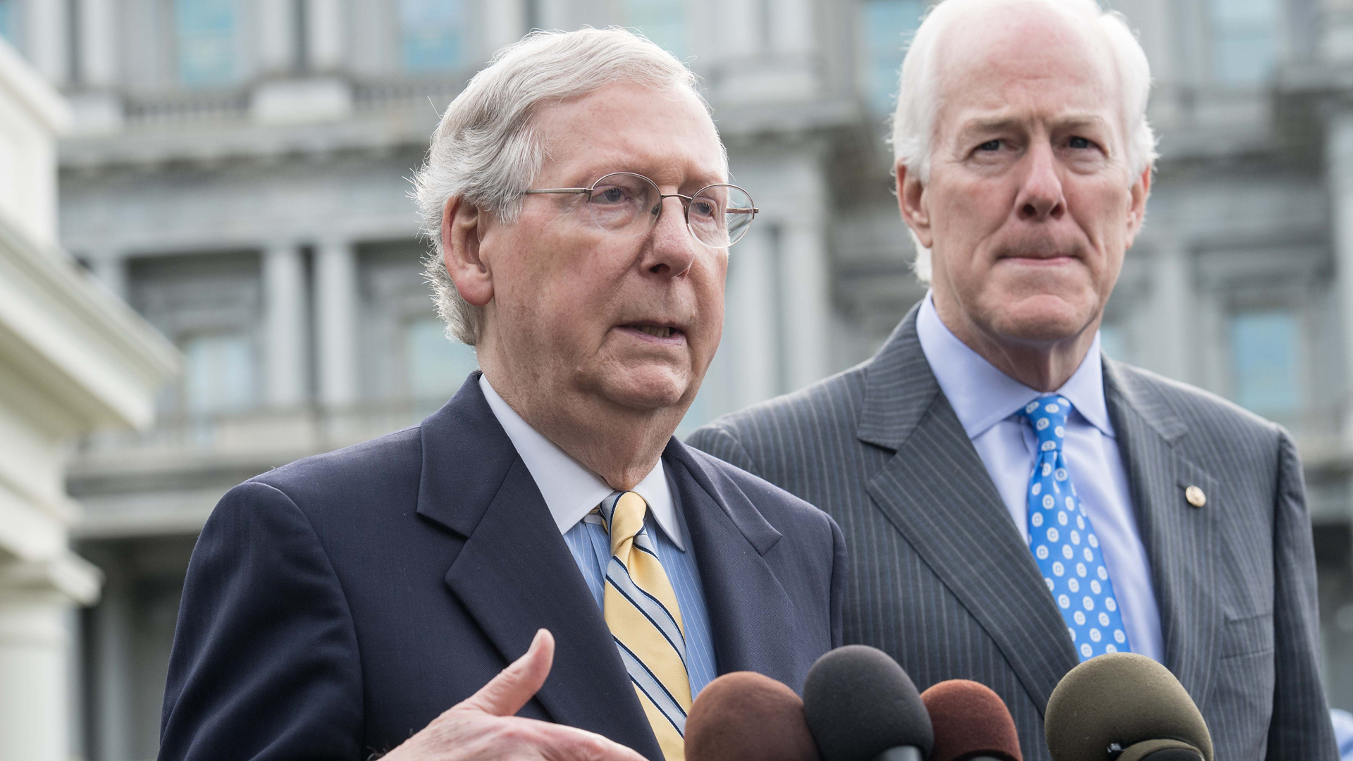 U.S. Senate Majority Leader Mitch McConnell and Majority Whip John Cornyn speak to the press outside the White House following a meeting with President Donald Trump on June 27, 2017 to discuss the GOP's efforts to repeal and replace the Affordable Care Act. (Credit: Nicholas Kamm /AFP /Getty Images)