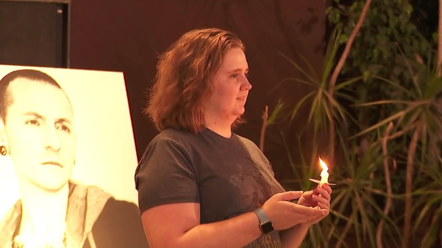 A fan pays tribute to late Linkin Park singer Chester Bennington, who died on Thursday, during a Burbank vigil on Tuesday. (Credit: KTLA)