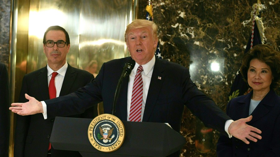 President Donald Trump speaks to the press about protests in Charlottesville after his statement on infrastructure in the lobby at Trump Tower in New York City on Aug. 15, 2017. (Credit: JIM WATSON/AFP/Getty Images)