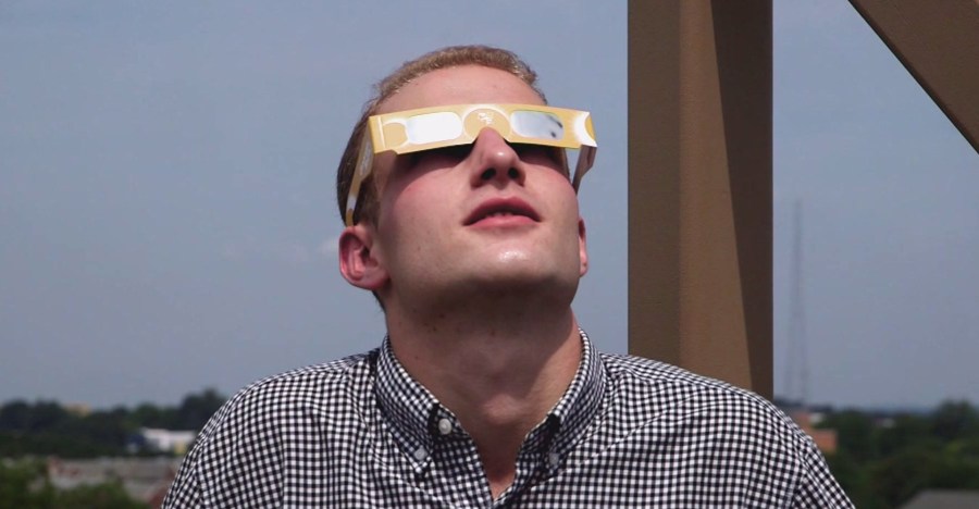 A man wears special eyewear for watching the solar eclipse. (Credit: KTLA)