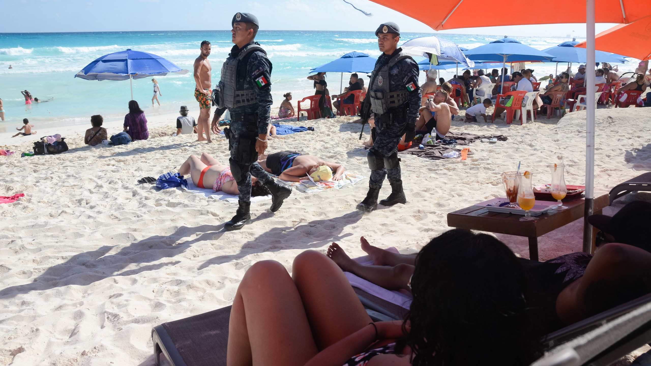 The Mexican federal police patrol a beach in Cancun, Mexico, on Jan. 18, 2017, where a shooting occurred in a nightclub the day before. (Credit: STR/AFP/Getty Images)