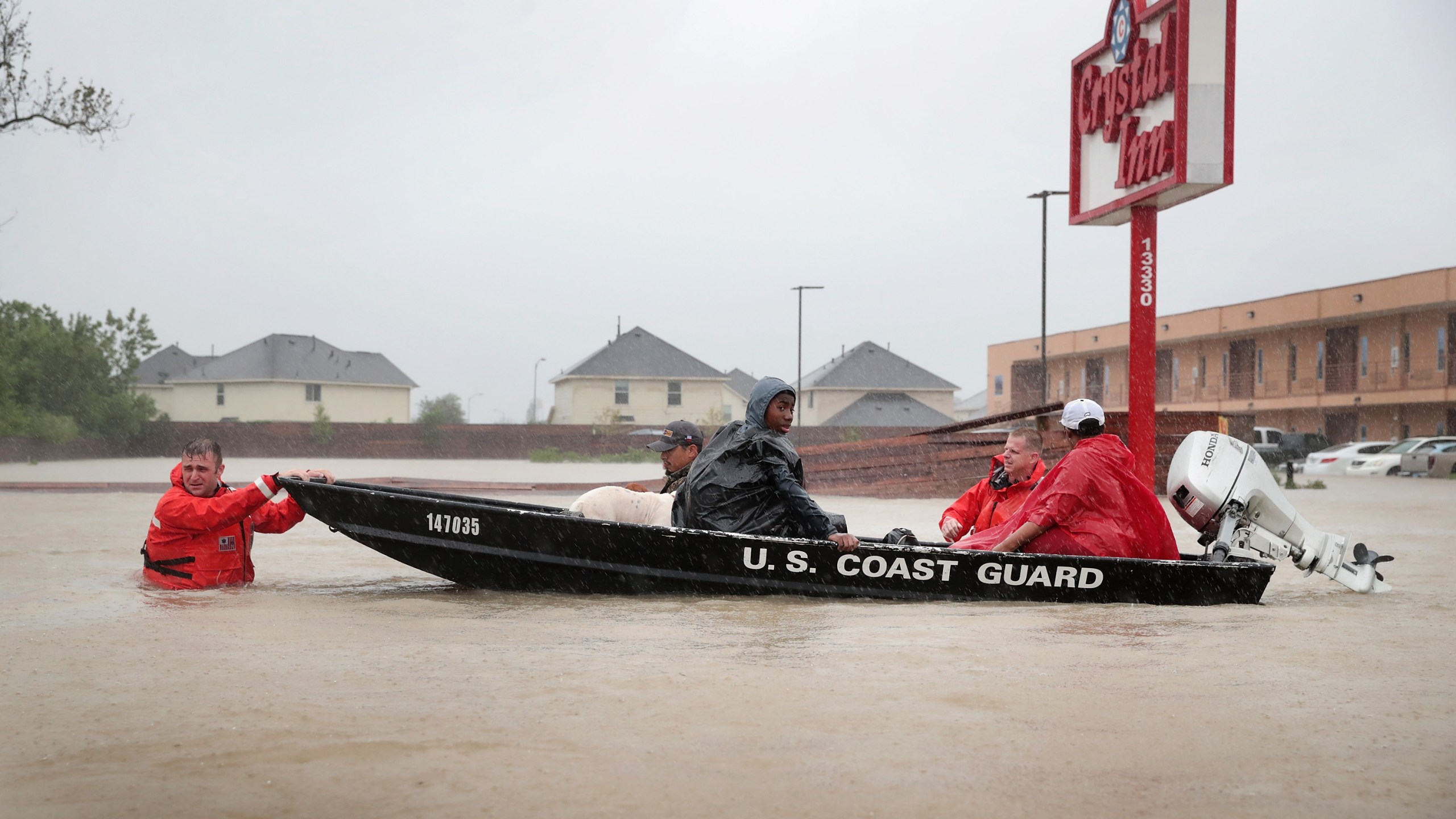 People are rescued from a flooded neighborhood after it was inundated with rain water, remnants of Hurricane Harvey, on Aug. 28, 2017, in Houston, Texas. (Credit: Scott Olson / Getty Images)