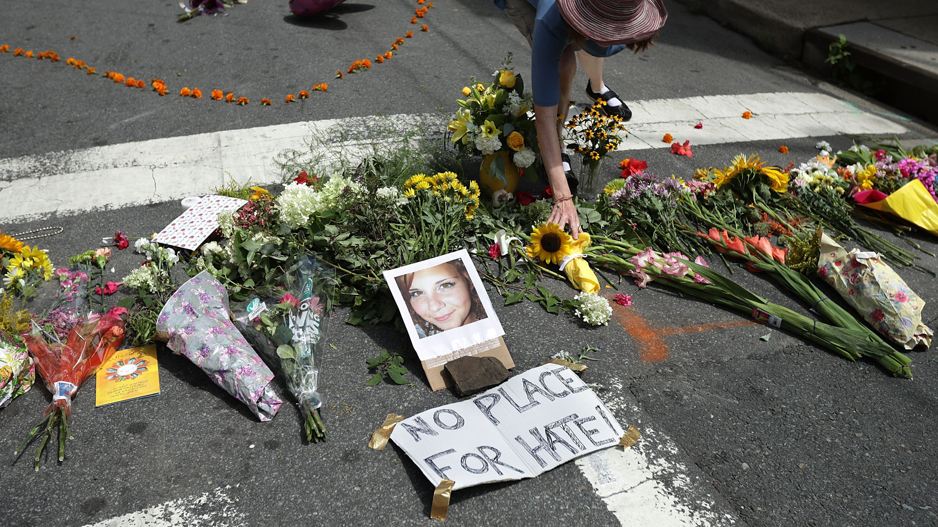 Flowers are placed at an informal memorial to 32-year-old Heather Heyer, who was killed when a car plowed into a crowd of people protesting against the white supremacist Unite the Right rally, August 13, 2017 in Charlottesville, Virginia. (Credit: Chip Somodevilla/Getty Images)