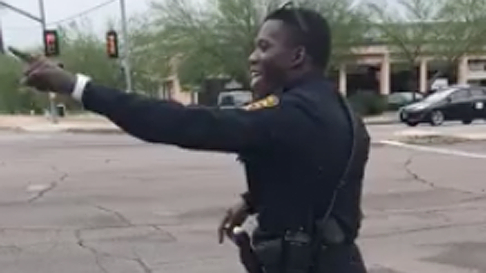 A Tucson Police officer is seen entertaining passing motorists. (Credit: Tucson Police Department)