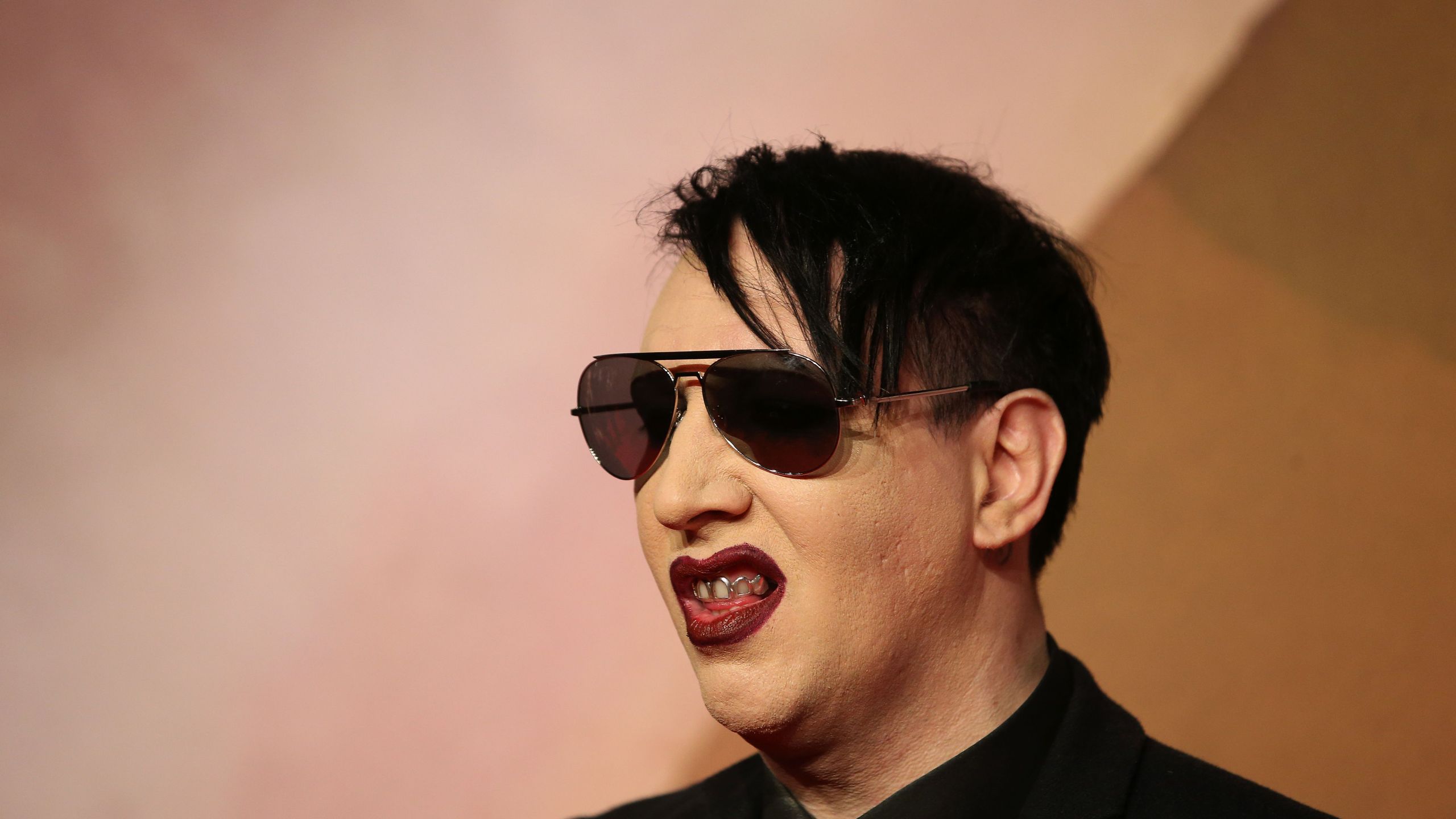 Singer Marilyn Manson poses for pictures on the red carpet upon arrival to attend the British Fashion Awards 2016 in London on Dec. 5, 2016. (Credit: DANIEL LEAL-OLIVAS/AFP/Getty Images)