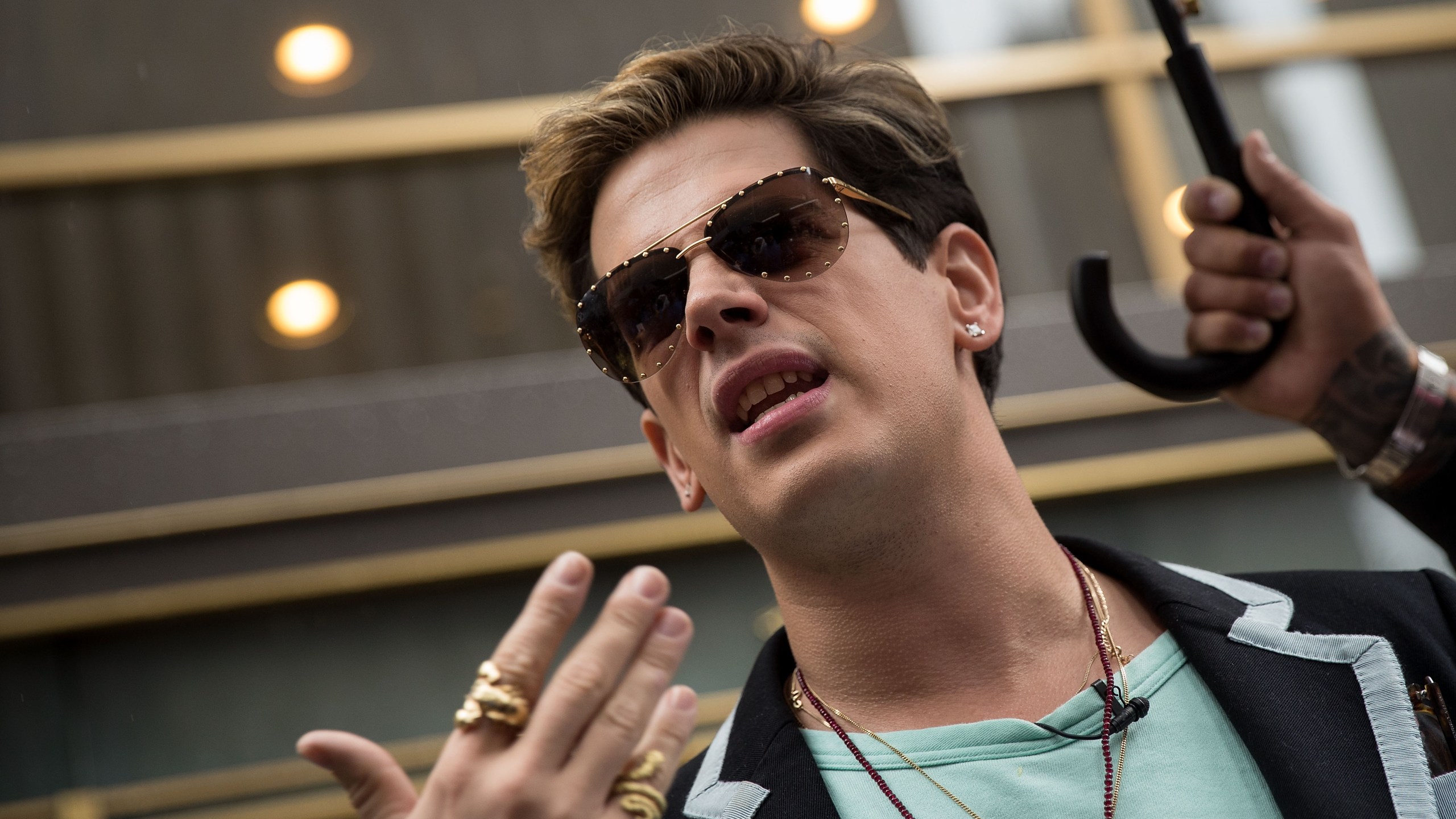 Milo Yiannopoulos speaks outside the offices of Simon & Schuster publishing company, July 7, 2017 in New York City after filing a $10 million legal complaint against the publisher following its decision to cancel his book deal. (Credit: Drew Angerer/Getty Images)