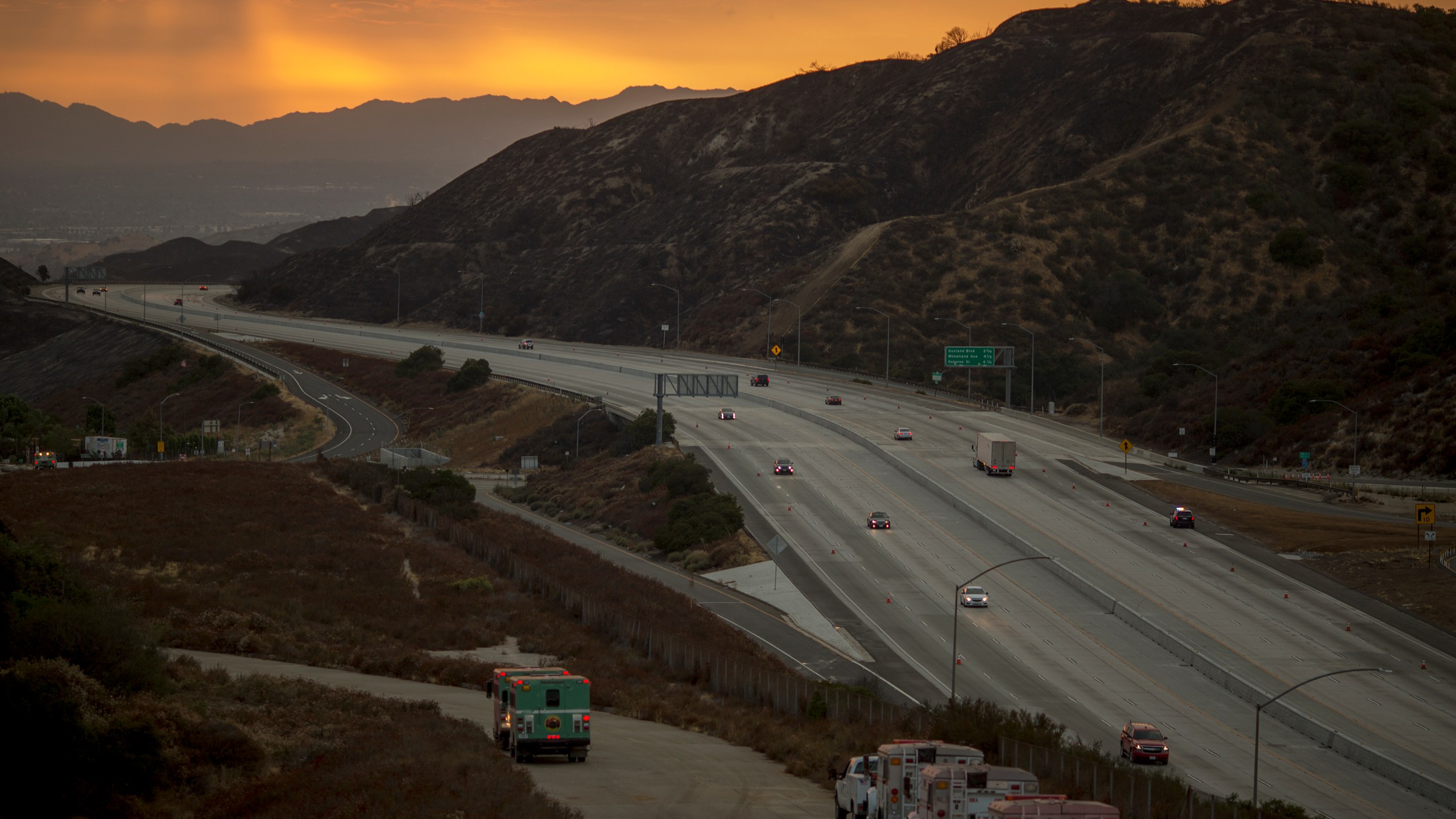 Traffic on the 210 freeway is allowed to resume for the first time since the start of the La Tuna Fire, as light rain showers pass over the burn areas on Sept. 3, 2017. (David McNew / Getty Images)