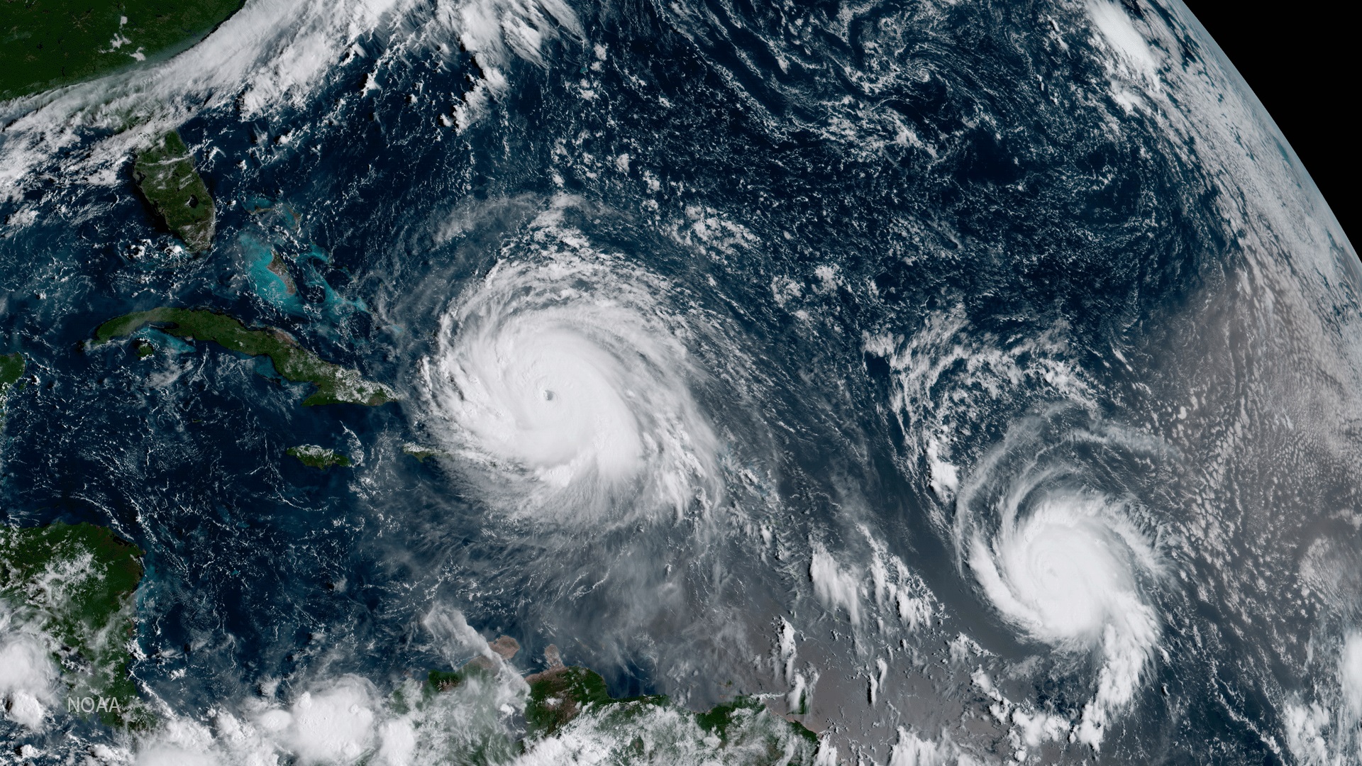 In this NOAA handout image, NOAA's GOES satellite shows Hurricane Irma, left, and Hurricane Jose on Sept. 7, 2017, in the Atlantic Ocean. (Credit: NOAA GOES Project via Getty Images)