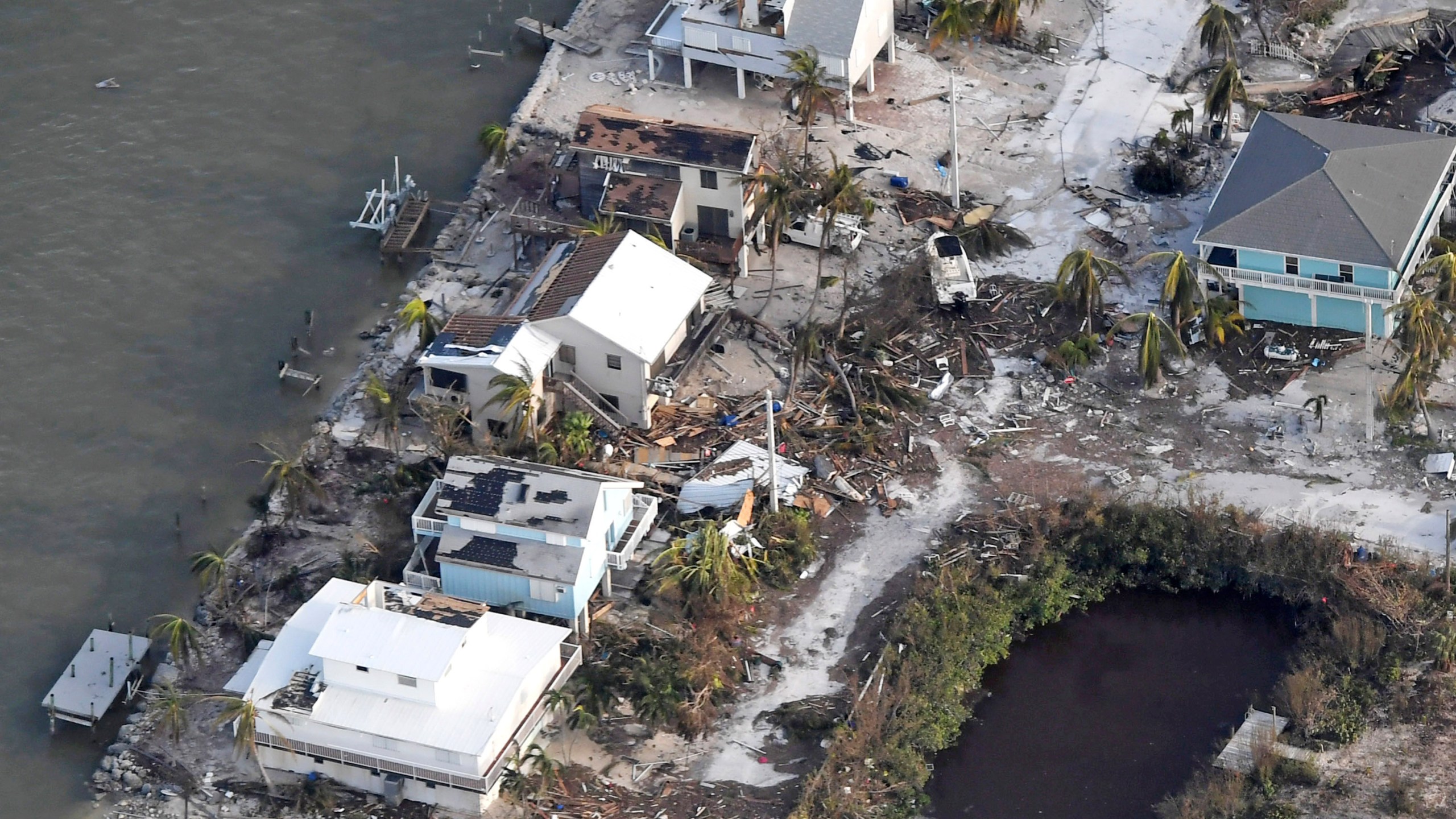 Damaged houses are seen in the aftermath of Hurricane Irma on September 11, 2017 over the Florida Keys, Florida (Credit: Matt McClain -Pool/Getty Images)