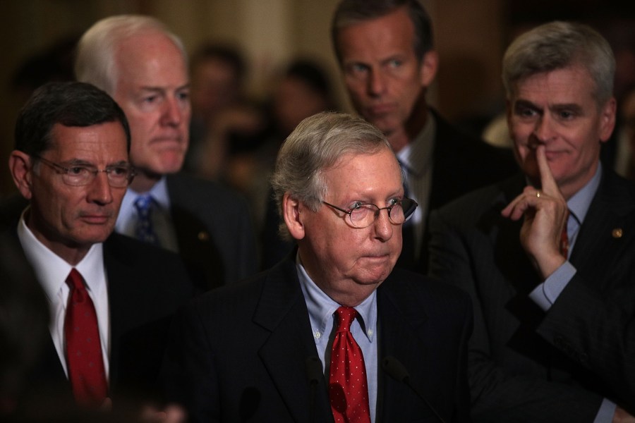 U.S. Senate Majority Leader Sen. Mitch McConnell, center, speaks as Sen. John Barrasso, Senate Majority Whip John Cornyn, Sen. John Thune and Sen. Bill Cassidy listen during a news briefing at the Capitol Sept. 19, 2017. (Credit: Alex Wong/Getty Images)