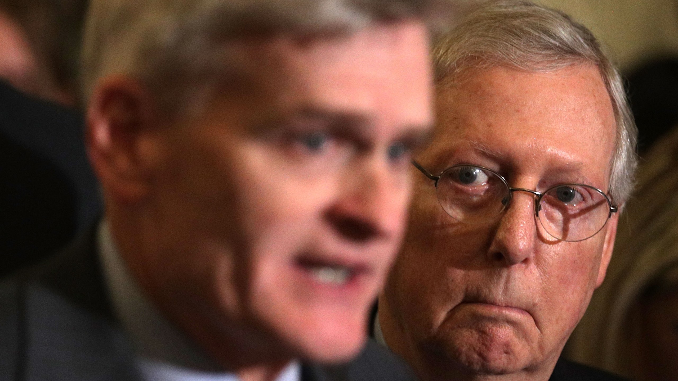 Sen. Bill Cassidy, left, speaks as Senate Majority Leader Sen. Mitch McConnell listens during a news briefing after the weekly Senate Republican policy luncheon at the Capitol Sept. 19, 2017. (Credit: Alex Wong/Getty Images)