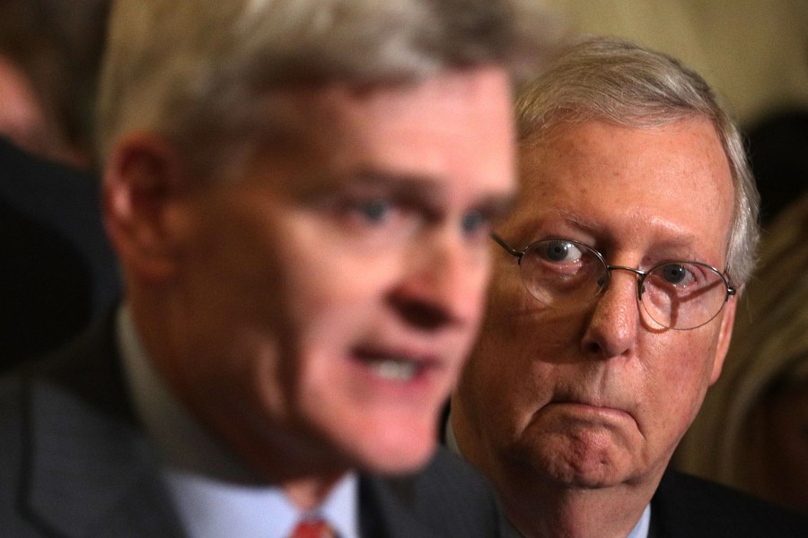 Sen. Bill Cassidy, left, speaks as Senate Majority Leader Sen. Mitch McConnell listens during a news briefing after the weekly Senate Republican policy luncheon at the Capitol Sept. 19, 2017. (Credit: Alex Wong/Getty Images)