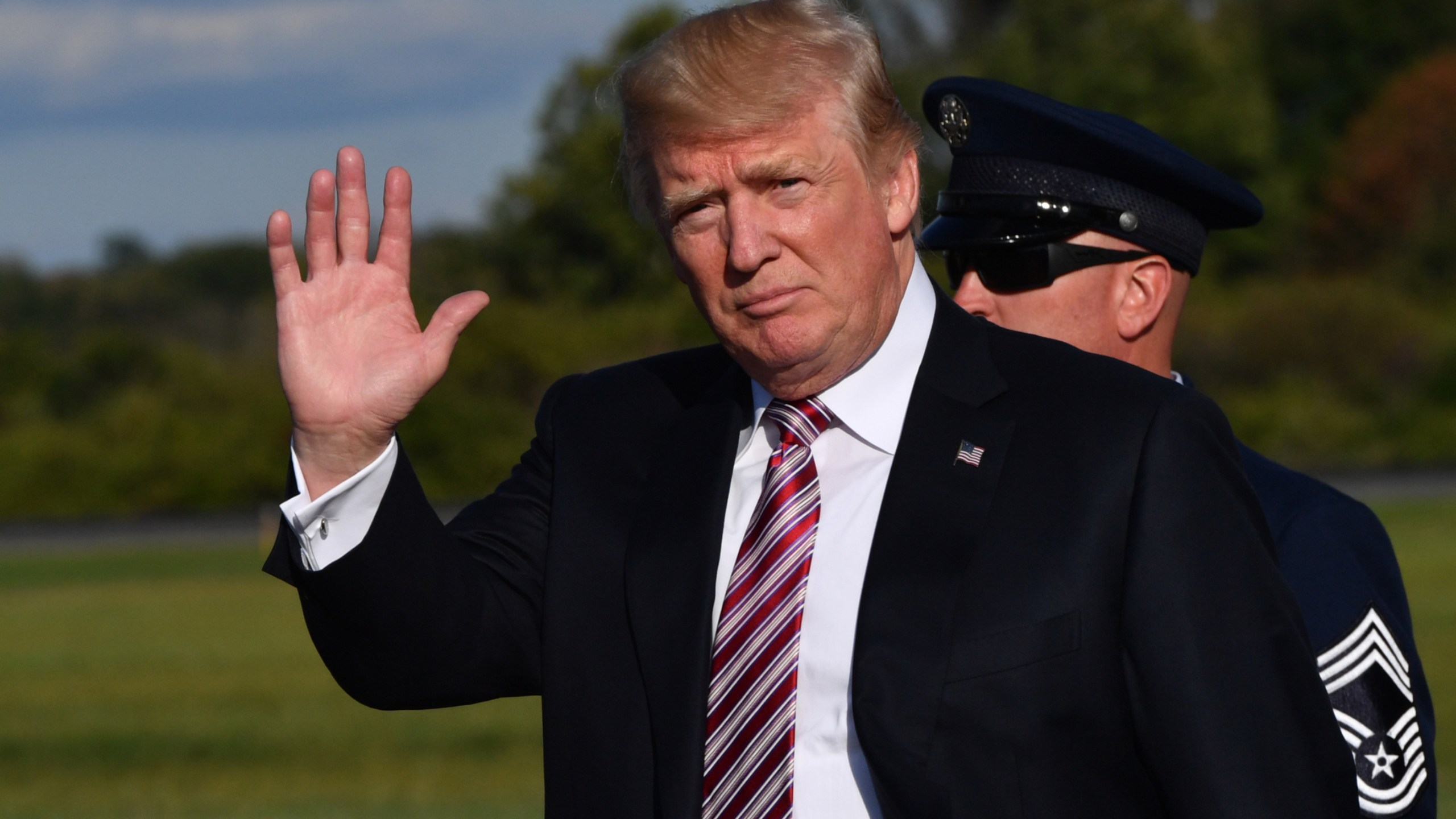 Donald Trump disembarks from Air Force One at Morristown Municipal Airport on September 29, 2017 in Morristown, New Jersey, as he travels to spend the weekend at his golf course in Bedminster. (Credit: Nicholas Kamm/AFP/Getty Images)