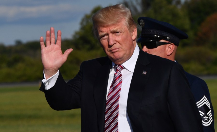 Donald Trump disembarks from Air Force One at Morristown Municipal Airport on September 29, 2017 in Morristown, New Jersey, as he travels to spend the weekend at his golf course in Bedminster. (Credit: Nicholas Kamm/AFP/Getty Images)