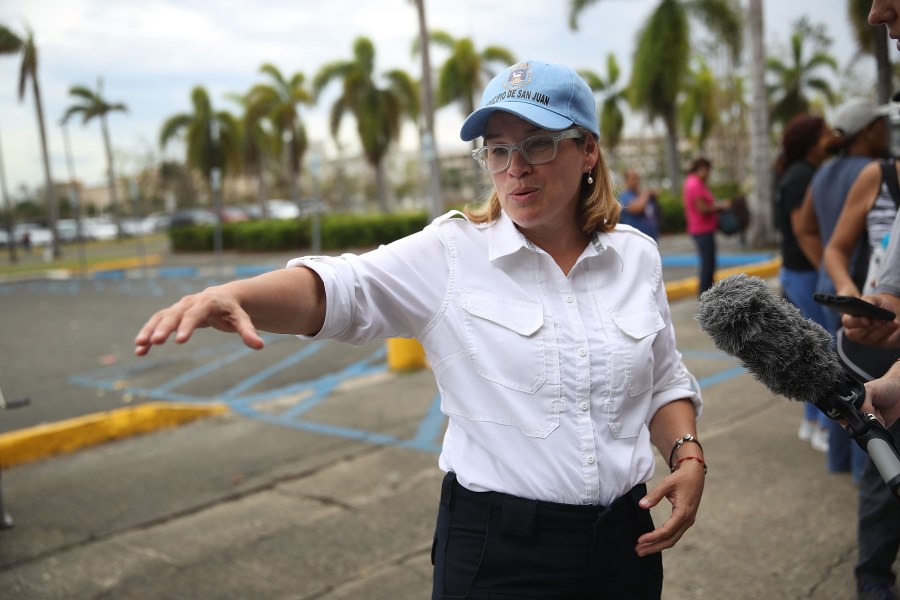 San Juan Mayor Carmen Yulin Cruz speaks to the media as she arrives at the temporary government center setup at the Roberto Clemente stadium in the aftermath of Hurricane Maria on September 30, 2017. (Credit: Joe Raedle/Getty Images)