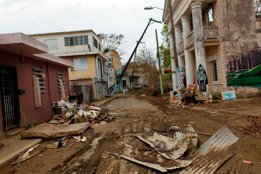 A street is left covered in debris in the aftermath of Hurricane Maria, in Arecibo, Puerto Rico, on Sept. 30, 2017.(Credit: Ricardo Arduengo/AFP/Getty Images)