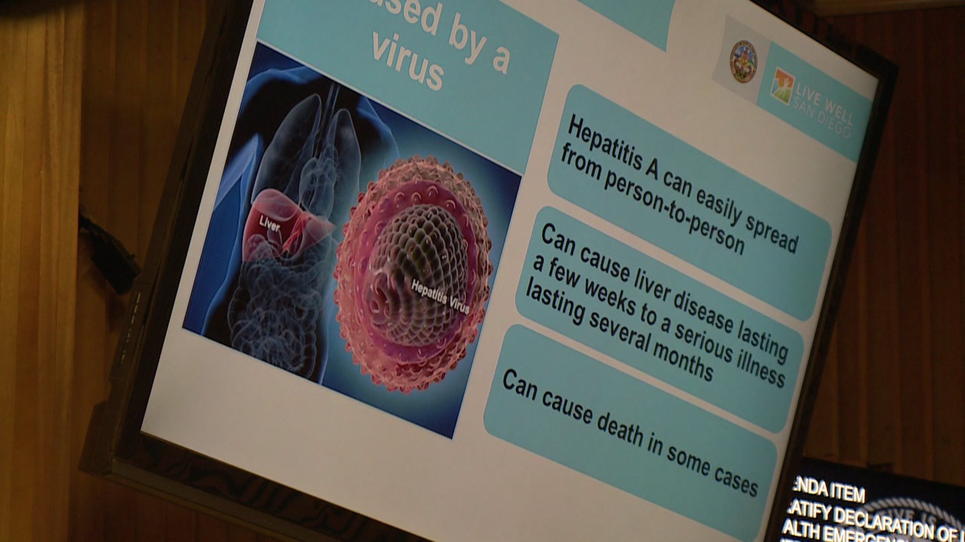 Information about hepatitis A is displayed at a meeting in San Diego where officials discussed the ongoing crisis in September 2017. (Credit: KSWB)