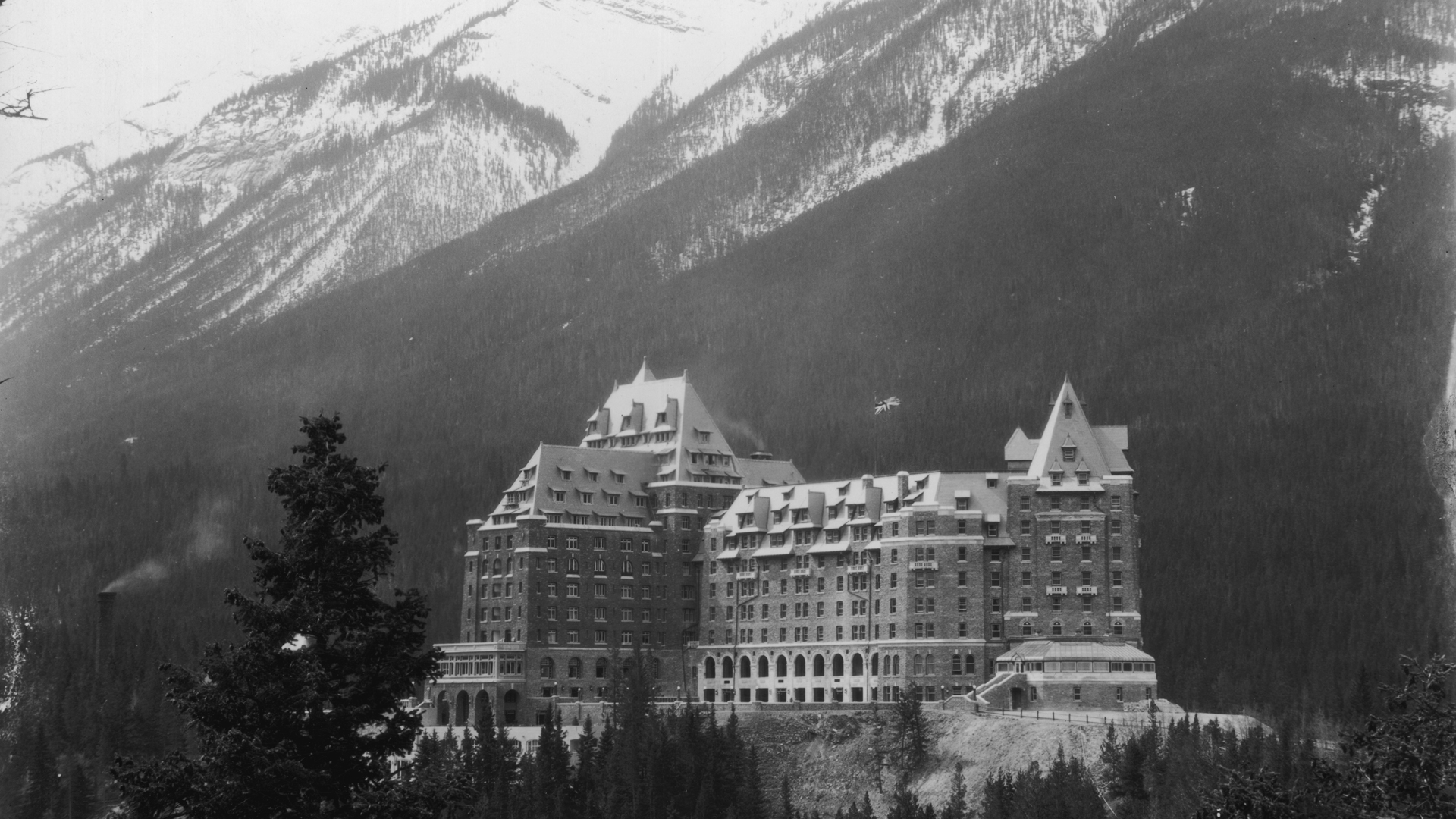 The majestic Banff Springs Hotel in the snowy mountains, near Alberta in Canada, one of the luxury resorts opened in 1888 by the Canadian Pacific Railroad (CPR) to encourage tourism. (Credit: Hulton Archive/Getty Images)