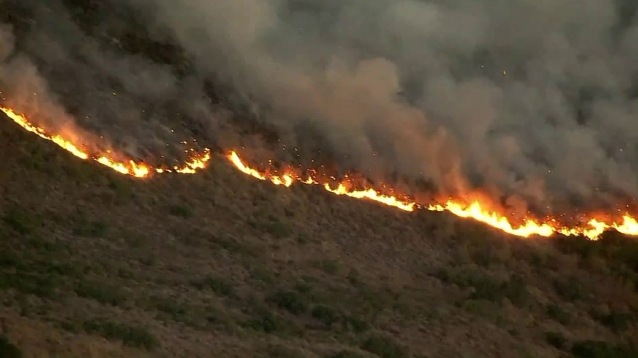 The Canyon Fire 2 burns a hillside in October 2017. (Credit: KTLA)