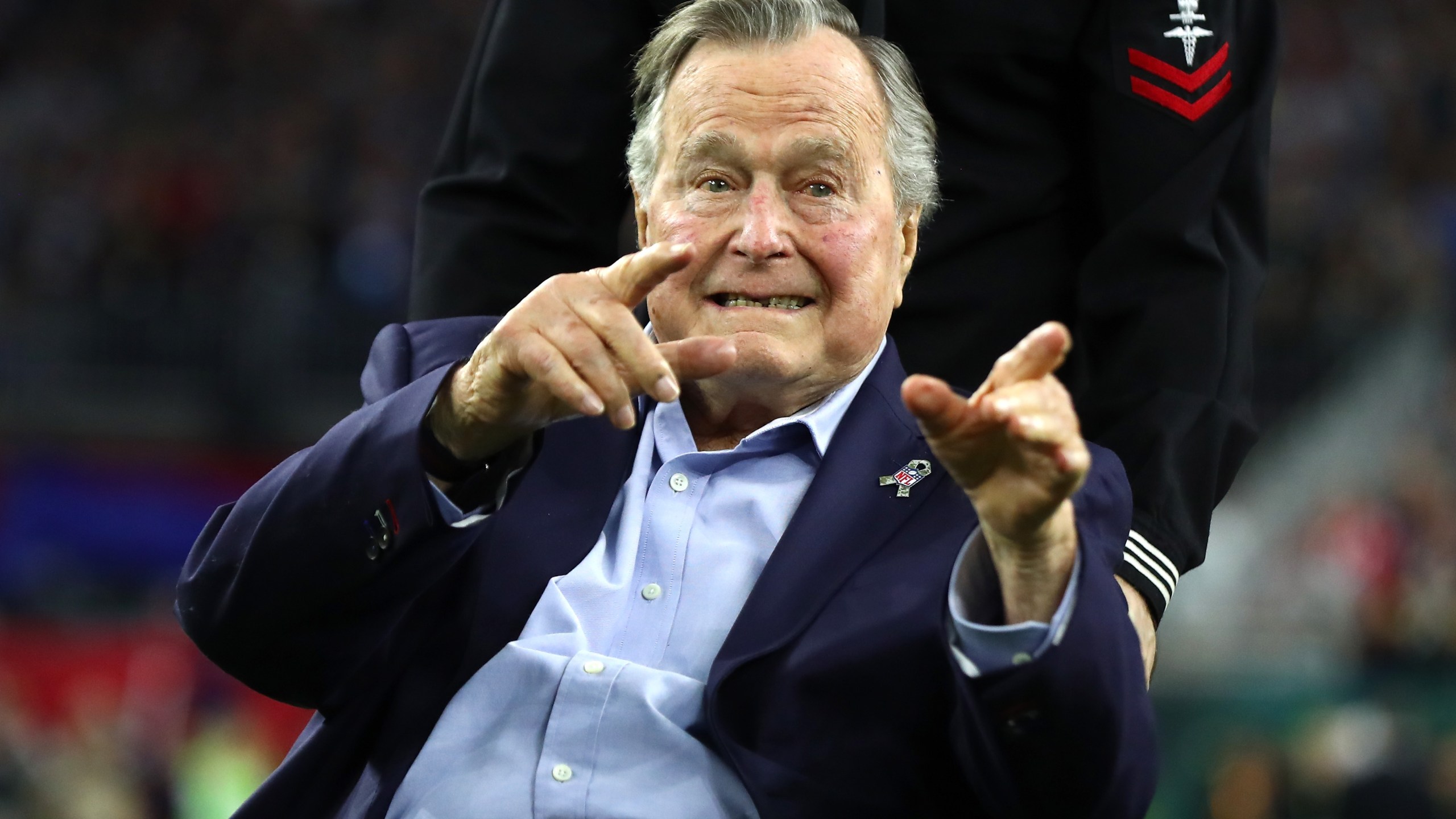 Former President George H.W. Bush arrives for the coin toss prior to Super Bowl 51 between the Atlanta Falcons and the New England Patriots at NRG Stadium on February 5, 2017 in Houston. (Credit: Al Bello/Getty Images)