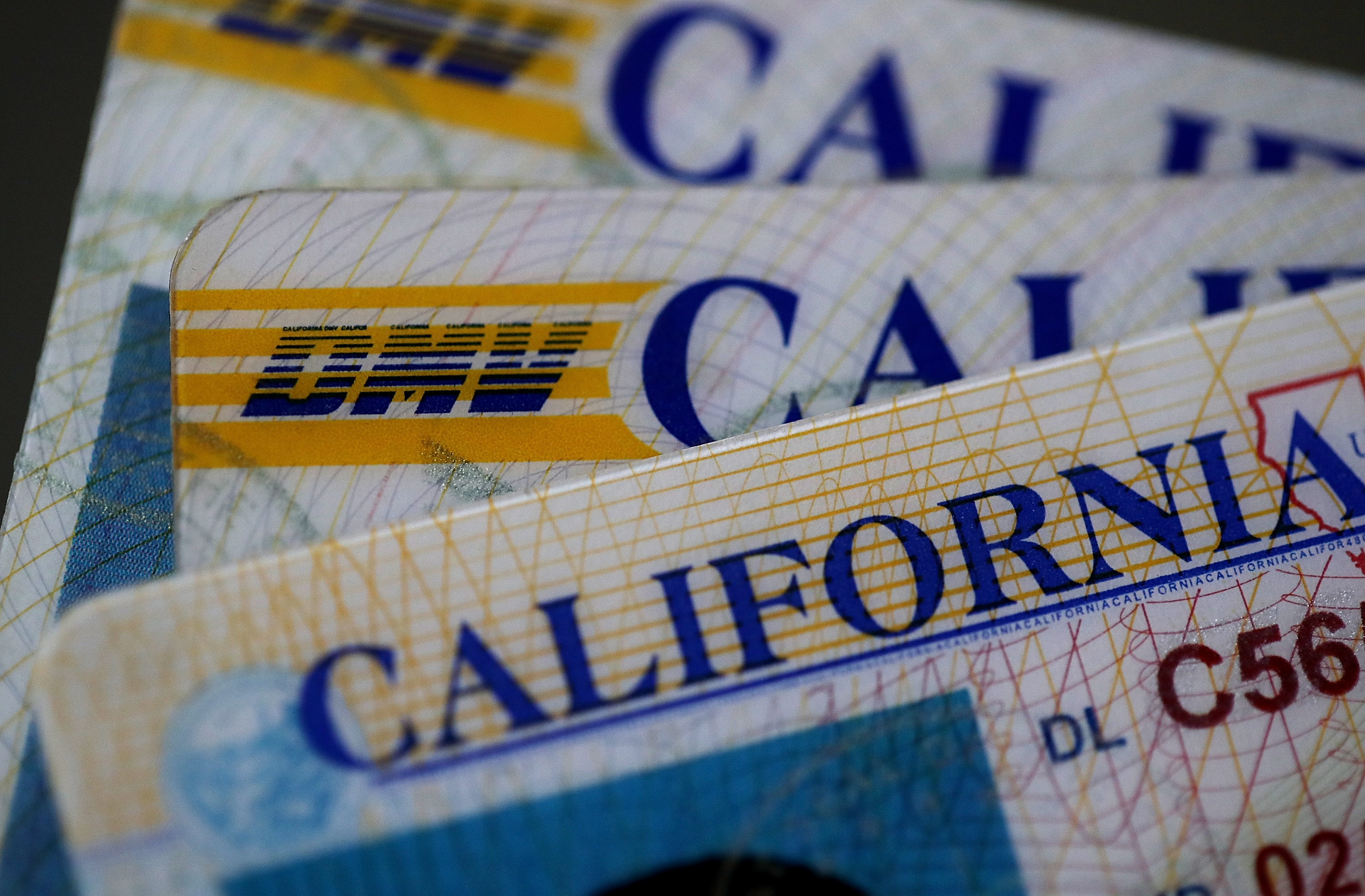 In this photo illustration, the California Department of Motor Vehicles (DMV) logo appears on a California driver license on May 9, 2017. (Credit: Justin Sullivan/Getty Images)