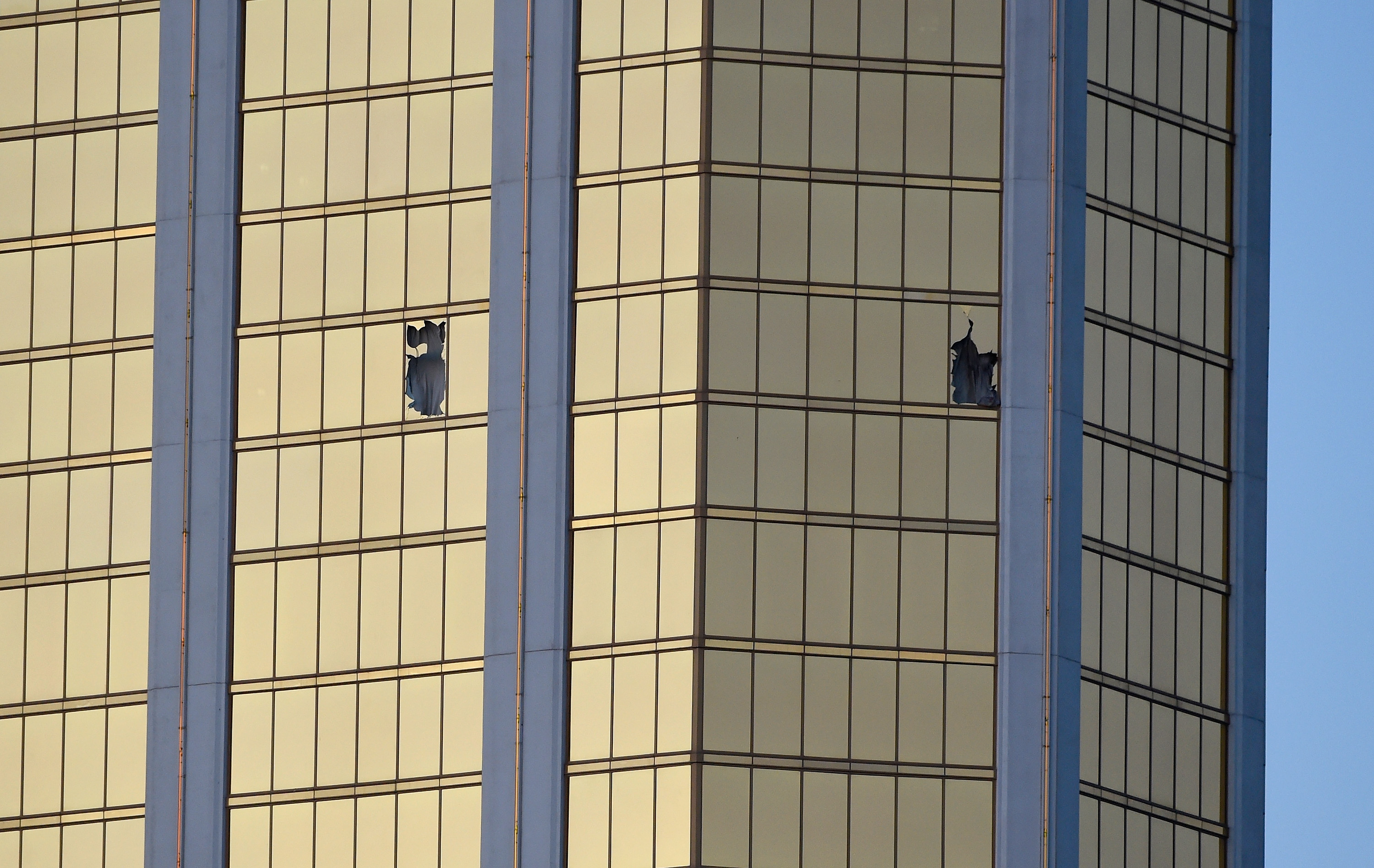 Broken windows are seen on the 32nd floor of the Mandalay Bay Resort and Casino after a lone gunman opened fired on the Route 91 Harvest country music festival on October 2, 2017 in Las Vegas, Nevada. (Credit: David Becker/Getty Images)